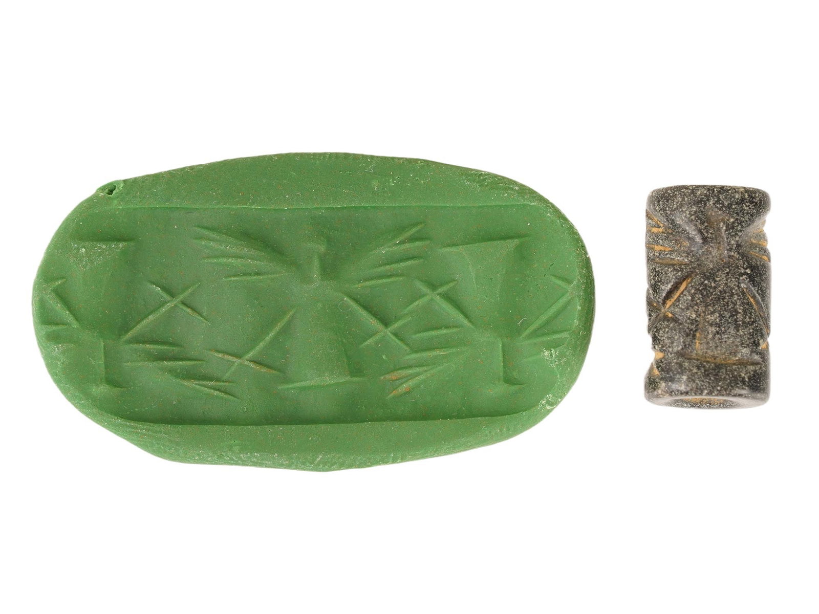 ANCIENT WESTERN ASIATIC CARVED STEATITE STONE SEAL BEAD: An ancient Western Asiatic carved Steatite stone seal bead of cylinder shape, circa the 2nd to the 1st Millennium BC. The seal is engraved with a ritual scene with mythological winged figures. Ancient