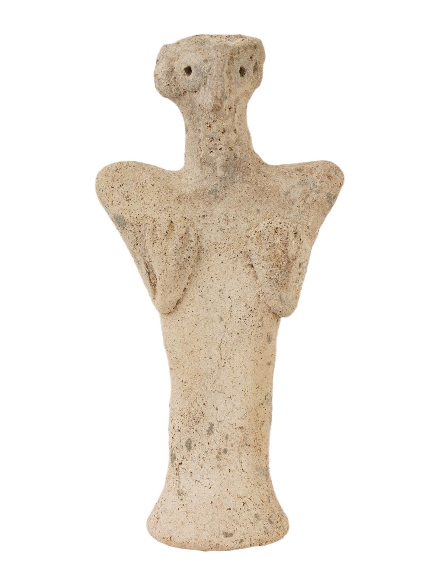 ANCIENT WEST ASIATIC HITTITE TERRACOTTA IDOL FIGURINE: An ancient West Asiatic, Syro Hittite terracotta idol depicting a female deity, presumably, Astarte, the goddess associated with fertility and love. The face is modeled with wide circular eyes and lar