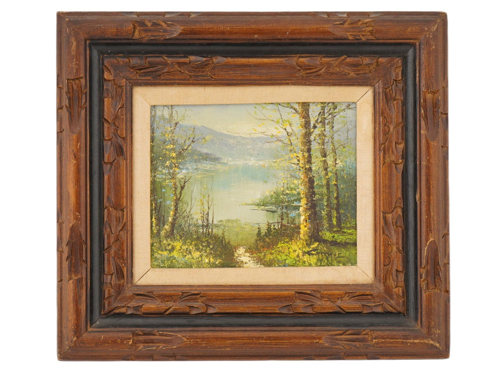 MID CENTURY OIL LANDSCAPE PAINTING SIGNED AND FRAMED: A mid-century oil landscape painting on canvas. The composition depicts a serene lake bordered by mature trees and lush greenery, with distant hills or mountains forming a calm backdrop. Signed lower