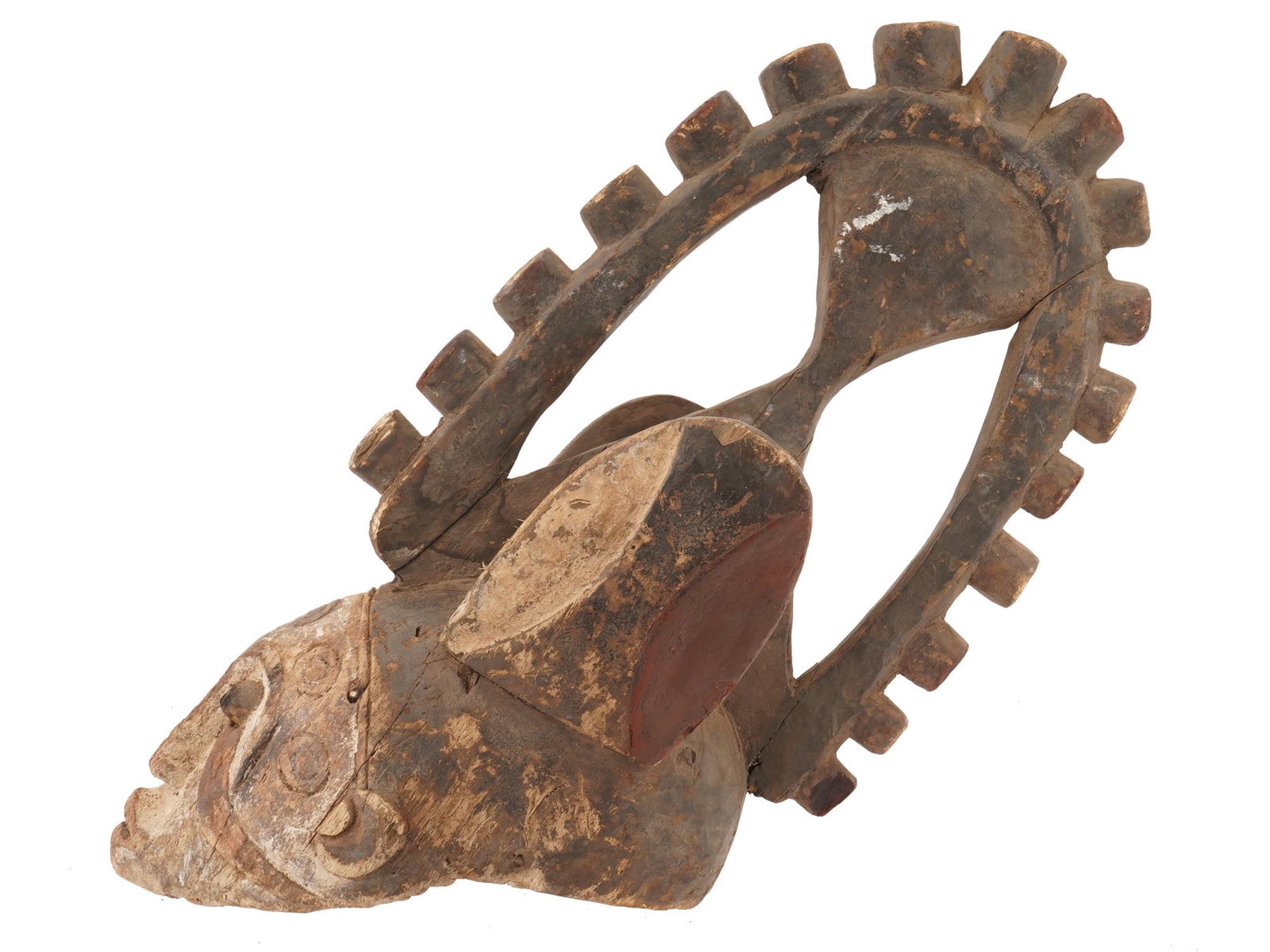 AFRICAN AGBOGHO MMUO HAND CARVED WOODEN HELMET MASK: An African Agbogho Mmuo hand-carved wooden helmet mask originates from the Igbo people of Nigeria, featuring a distinctive face characterized by a tapered face and small, circular eyes. The name trans