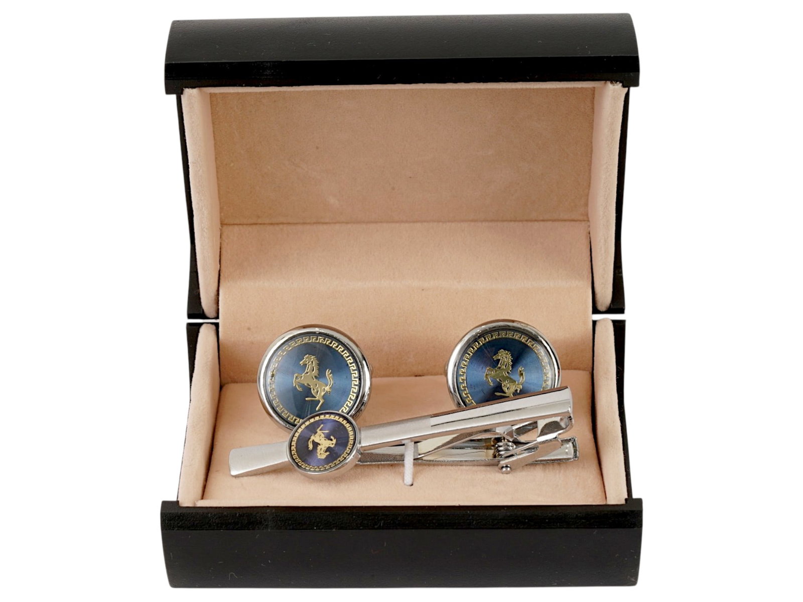 VINTAGE FERRARI SILVER TONED CUFFLINKS AND TIE PIN: A set of vintage Ferrari accessories, a pair of bullet-back cufflinks and a tie pin. Made of silver-tone metal. Design includes the Ferrari horse and meander motif. The set comes in a box. Jewelry And