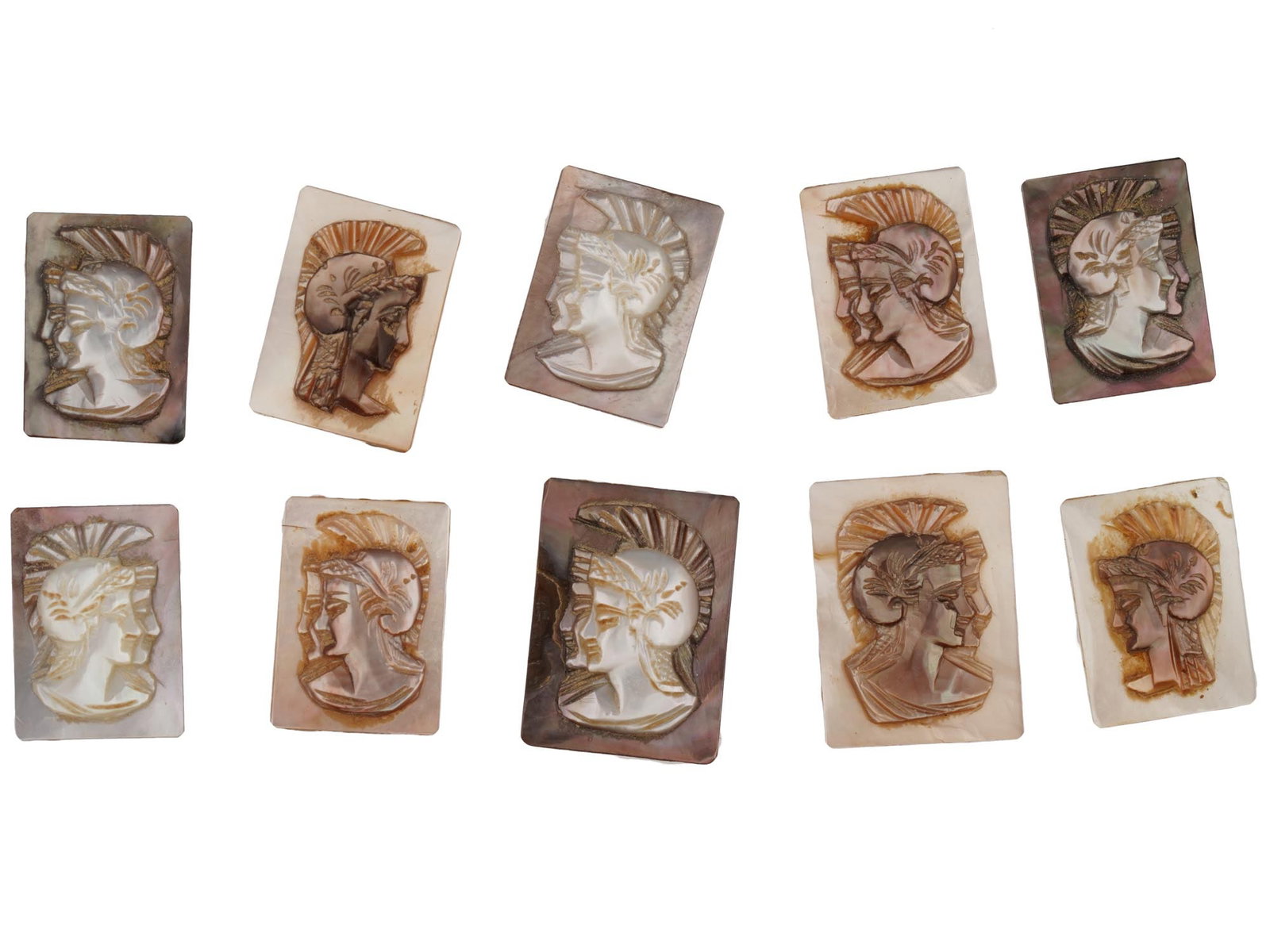 ANTIQUE VINTAGE GRECO ROMAN PROFILE CARVED SHELL CAMEOS: A set of ten antique or vintage carved shell cameos, each depicting the head profile of a Greco-Roman figure wearing a crested helmet. Carved from a mother of pearl or abalone shell, the pieces displa