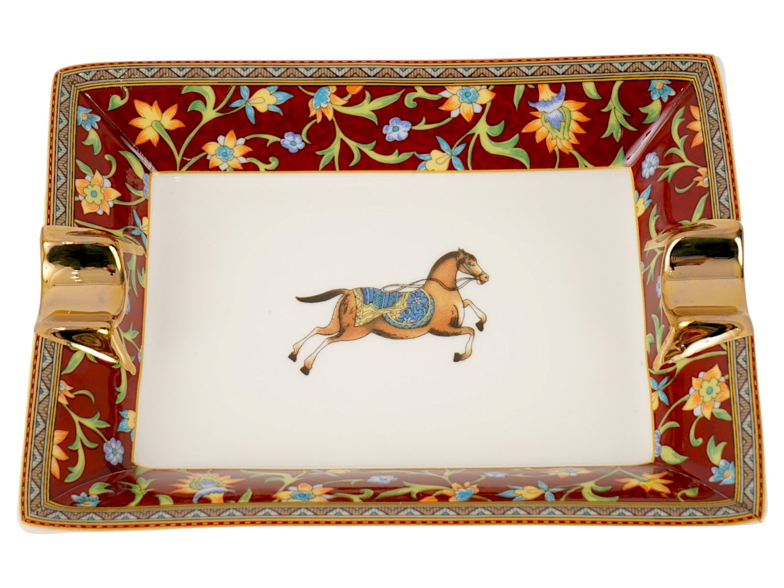 VINTAGE HERMES PORCELAIN ASHTRAY CHEVAL DORIENT: A vintage rectangular porcelain ashtray from the Cheval dOrient collection by Hermes. The design features a detailed horse motif inspired by Persian miniatures, framed by intricate floral borders. Cra
