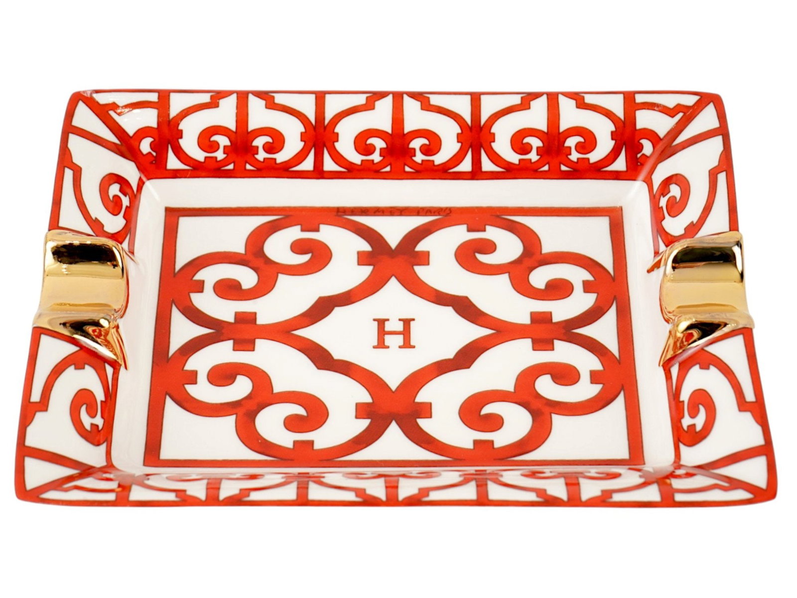 VINTAGE HERMES PORCELAIN ASHTRAY BALCON DU GUADALQUIVIR: A vintage porcelain ashtray from the Balcon du Guadalquivir collection by Hermes. Inspired by the wrought-iron balconies of Andalusia, the design features bold red geometric forms and flowing lines se