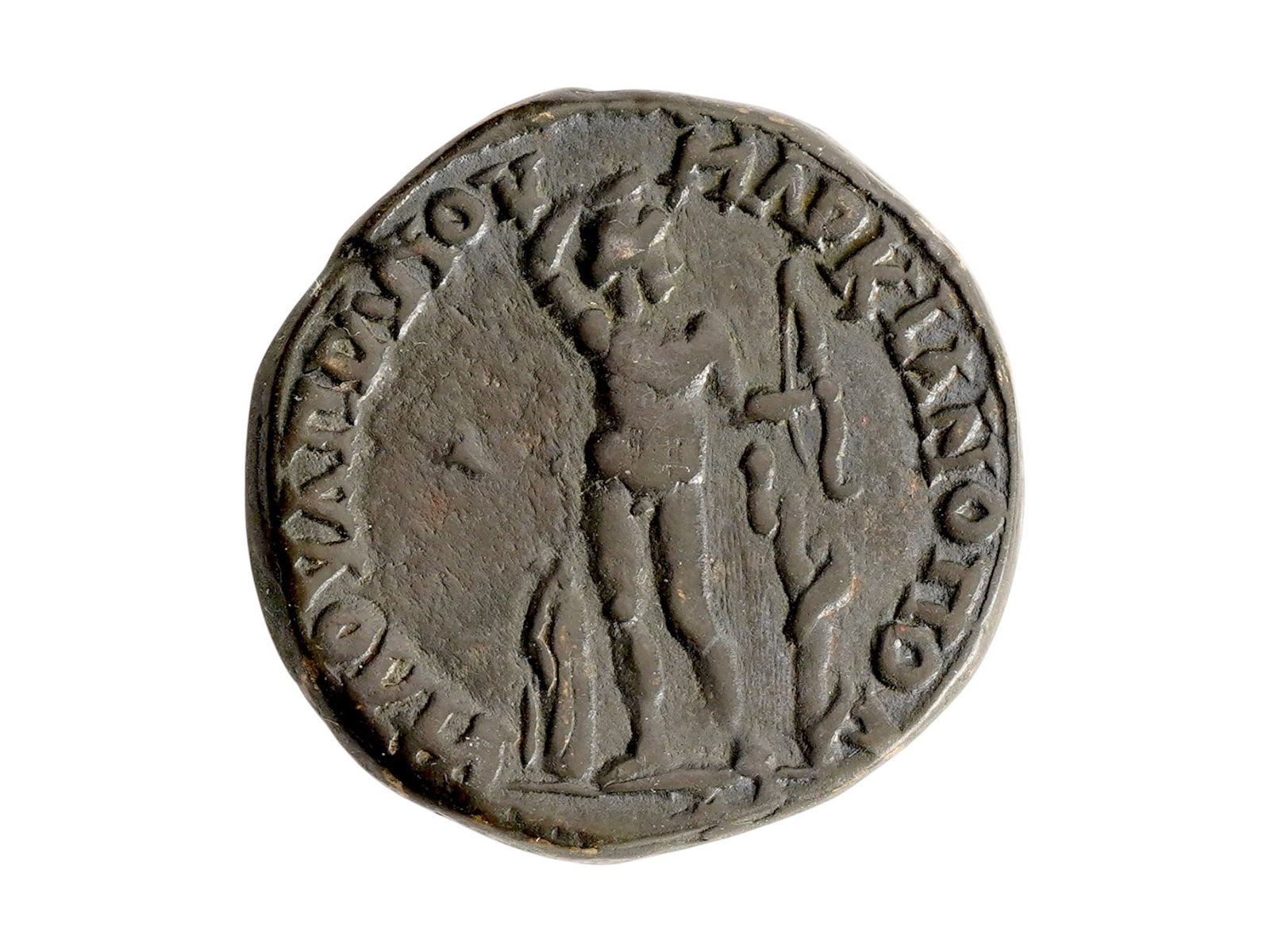 ANCIENT ROMAN BRONZE COIN CIRCA 100 TO 300 AD: An ancient Roman bronze coin, dating from circa 100 to 300 AD, struck during the height of the Roman Empire. The obverse features a portrait of an emperor, while the reverse displays symbolic imagery