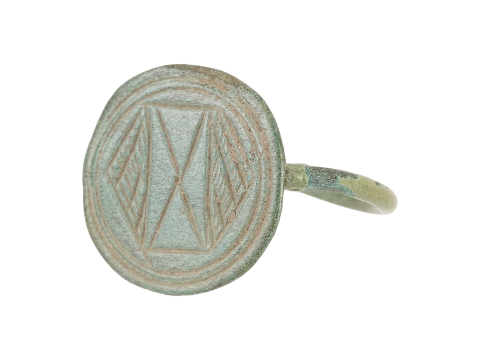 ANCIENT EGYPTIAN BRONZE SIGNET RING 700 TO 200 BC: An Ancient Egyptian bronze signet ring with an engraved design representing a pyramid motif and geometric patterns. Circa: Late Period, 700 to 200 BC. Historical Finds And Archaeological Relics, Jewel