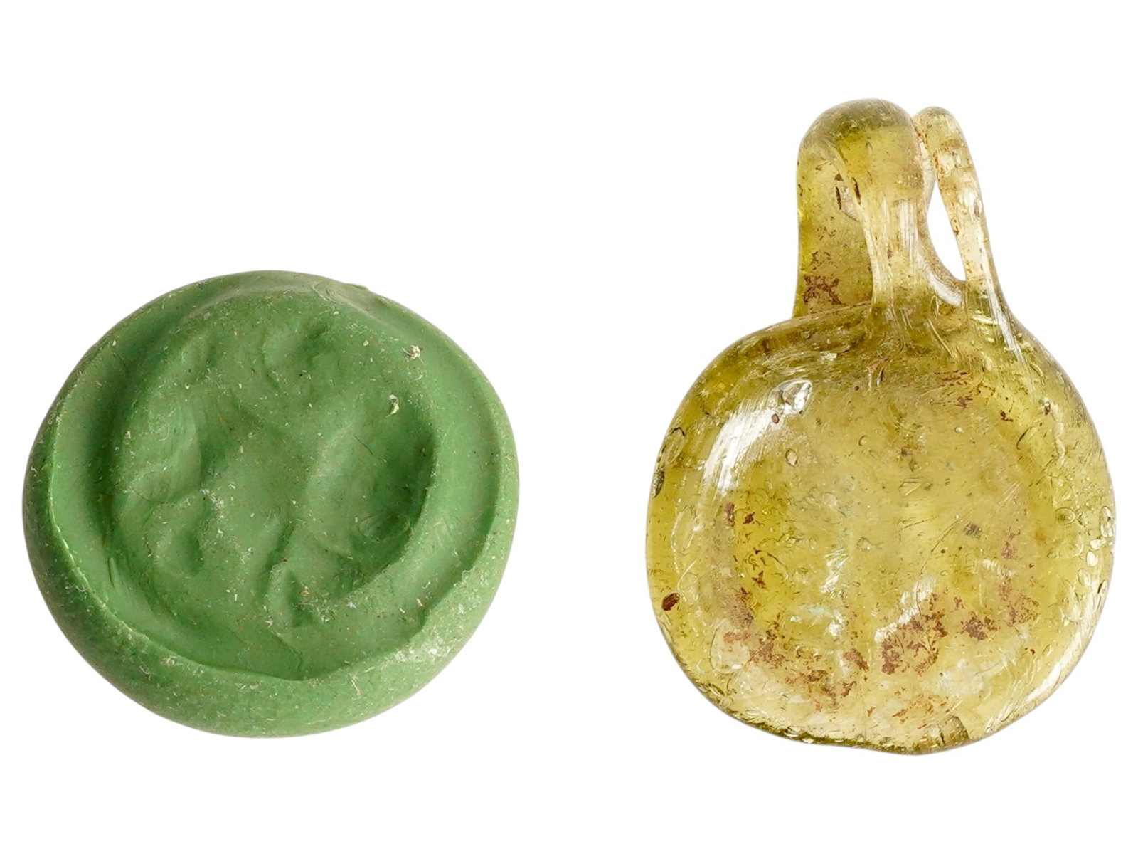 ANCIENT ROMAN EMPIRE GLASS PENDANT OF LION ZODIAC: An Ancient Roman glass pendant. Imperial Rome era, ca. 100 to 300 AD. The piece represents the Zodiac sign of Lion, crescent, and a star. Yellow glass shade. Collectible Archaeological Finds And Relic