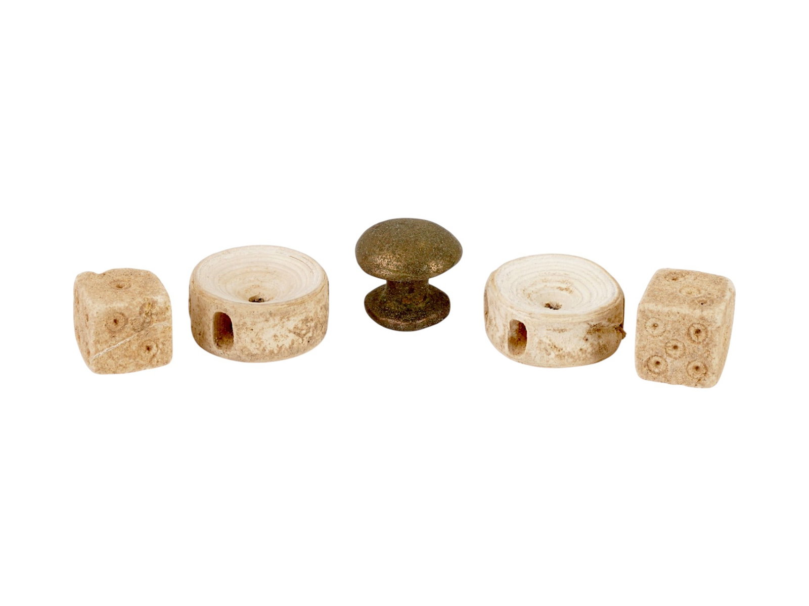 ANCIENT GAMING PIECES FROM THE ROMAN EMPIRE AND EARLIER: A group of ancient gaming pieces spanning from circa 100 AD to 700 AD, including examples from the Roman Empire and earlier traditions. Such pieces were used in a variety of board games and leisure ac