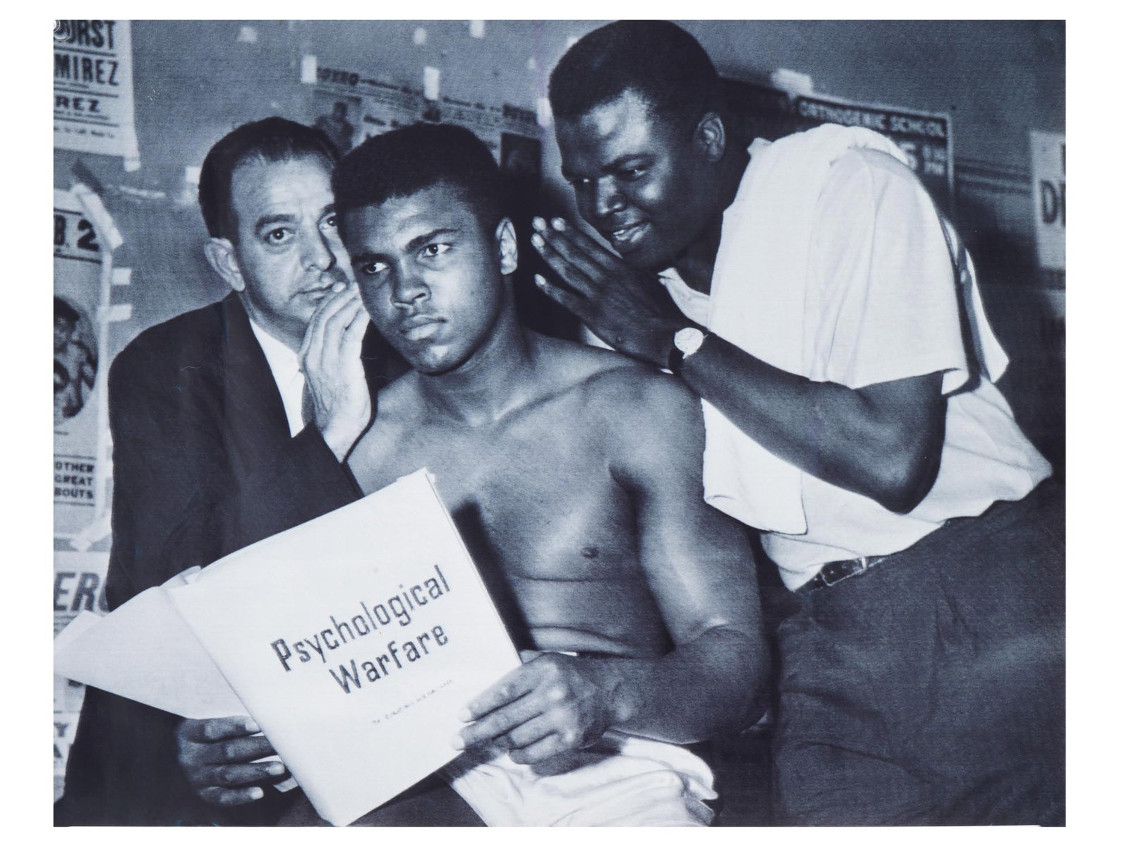 VTG BLACK AND WHITE PHOTO OF BOXER MUHAMMAD ALI: A vintage black and white photo with Muhammad Ali, 1942 to 2016, American professional boxer and social activist. The photo depicts Muhammad Ali and his trainers discussing psychological warfare in