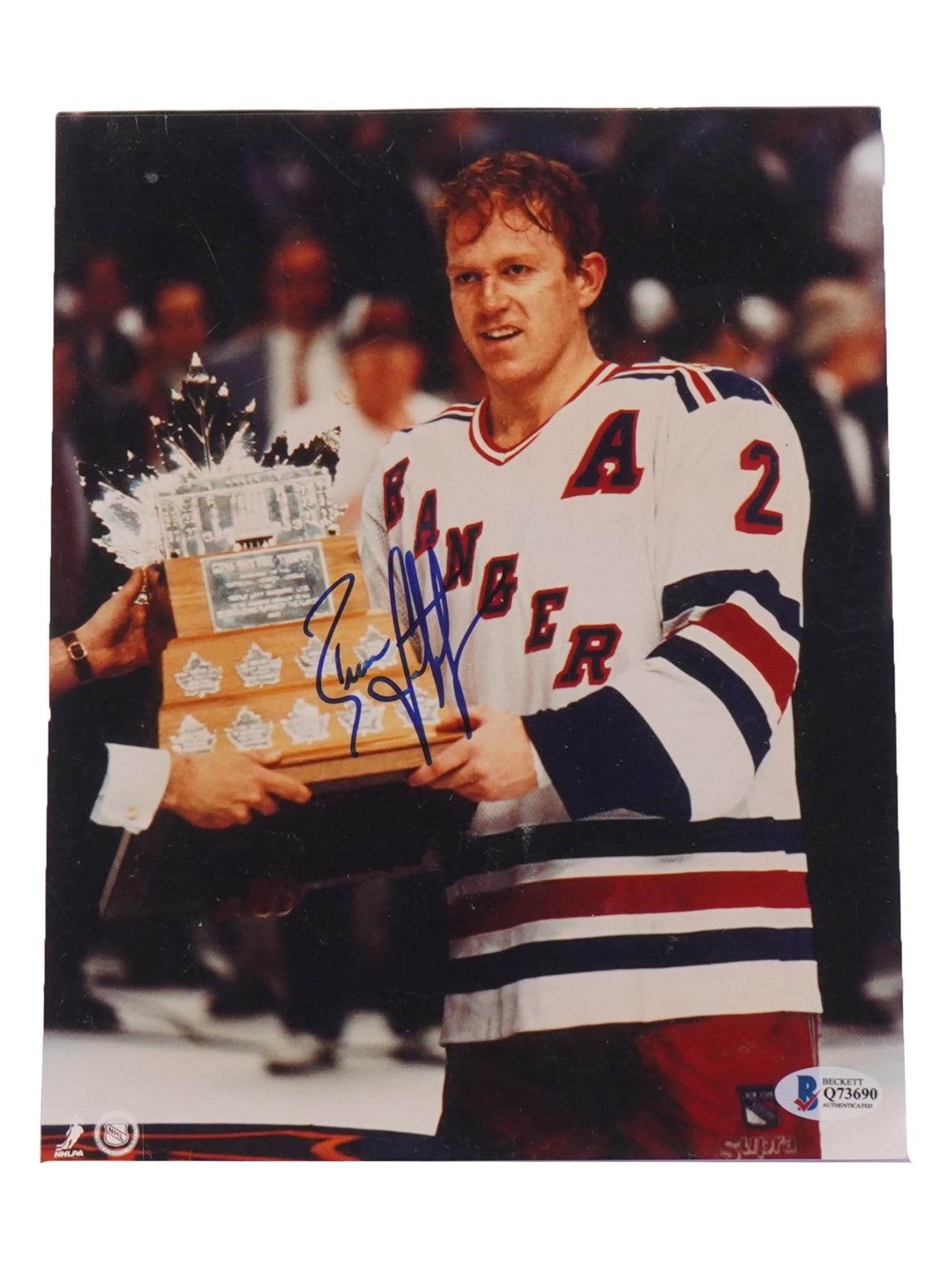 AMERICAN NHL LEETCH AUTOGRAPHED PHOTO W BECKETT COA: A color sports photograph depicting portrait of Brian Leetch, a former American professional NHL defenseman who spent most of his 18 year career with the New York Rangers. He holds the Stanley Cup