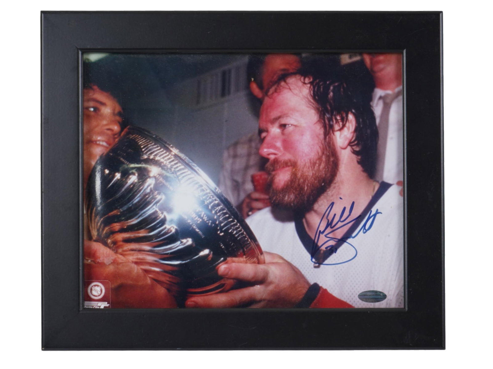 AUTOGRAPHED BY CANADIAN HOCKEY PLAYER BILLY SMITH PHOTO: A vintage sports photo depicting Canadian hockey player Billy Smith celebrating his Stanley Cup victory. The photo is autographed by the player. Framed. Hockey, Sport Collectibles. THIS LOT IS