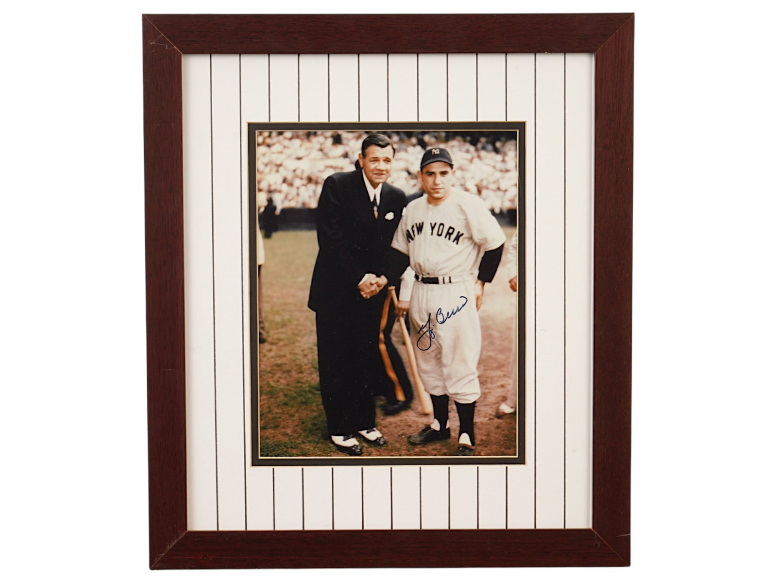 YOGI BERRA AUTOGRAPHED PHOTO FT BABE RUTH: A historical black and white photograph featuring Yogi Berra alongside an image of Babe Ruth, signed by Berra in blue ink. This piece bridges two of the greatest eras in Yankees history. Yankees, Yogi