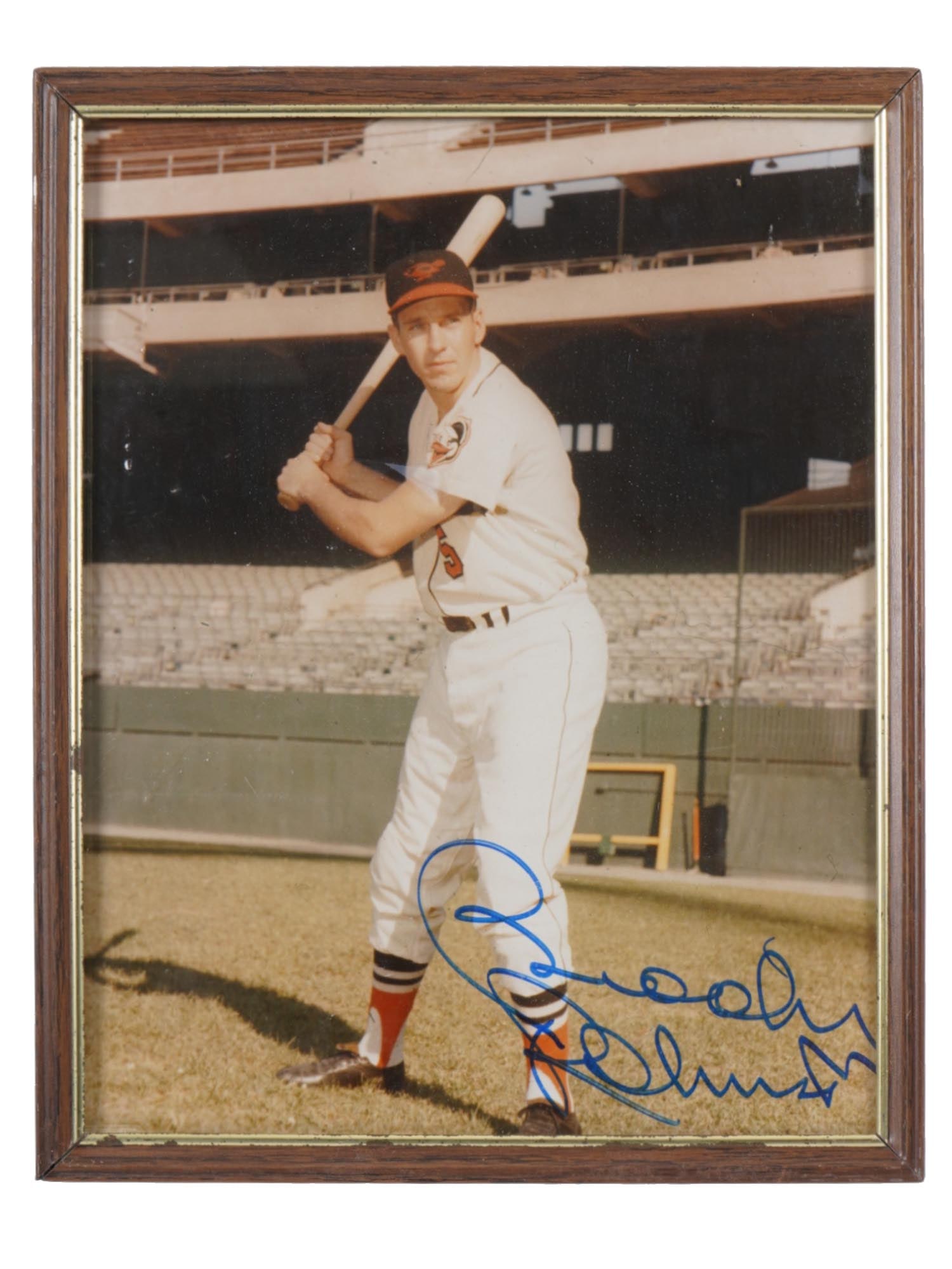 AMERICAN SPORTS PHOTO AUTOGRAPHED BY BROOKS ROBINSON: A color portrait photograph of Brooks Robinson batting. The photo is autographed, lower right. Framed. Brooks Calbert Robinson Jr., 1937 to 2023, was an American baseball player. Known as The Human Va