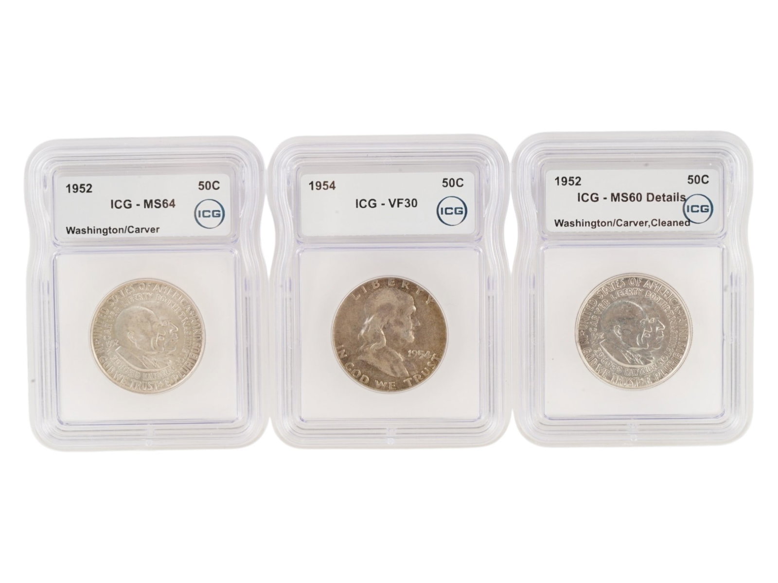 50 CENTS WASHINGTON CARVER FRANKLIN COINS GRADED BY ICG: A collection of three American Half Dollar commemorative coins, dedicated to George Washington Carver and Booker T. Washington, in protective holders slabs from the ICG company. The coins were issued