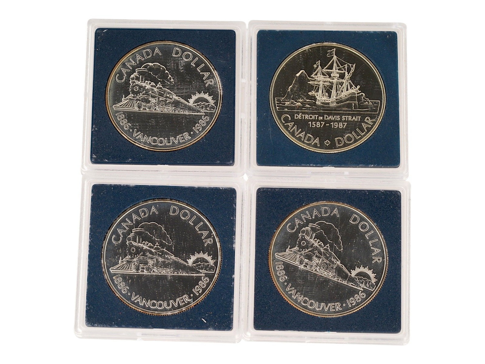 FOUR CANADIAN COMMEMORATIVE SILVER DOLLARS (1 of 2)