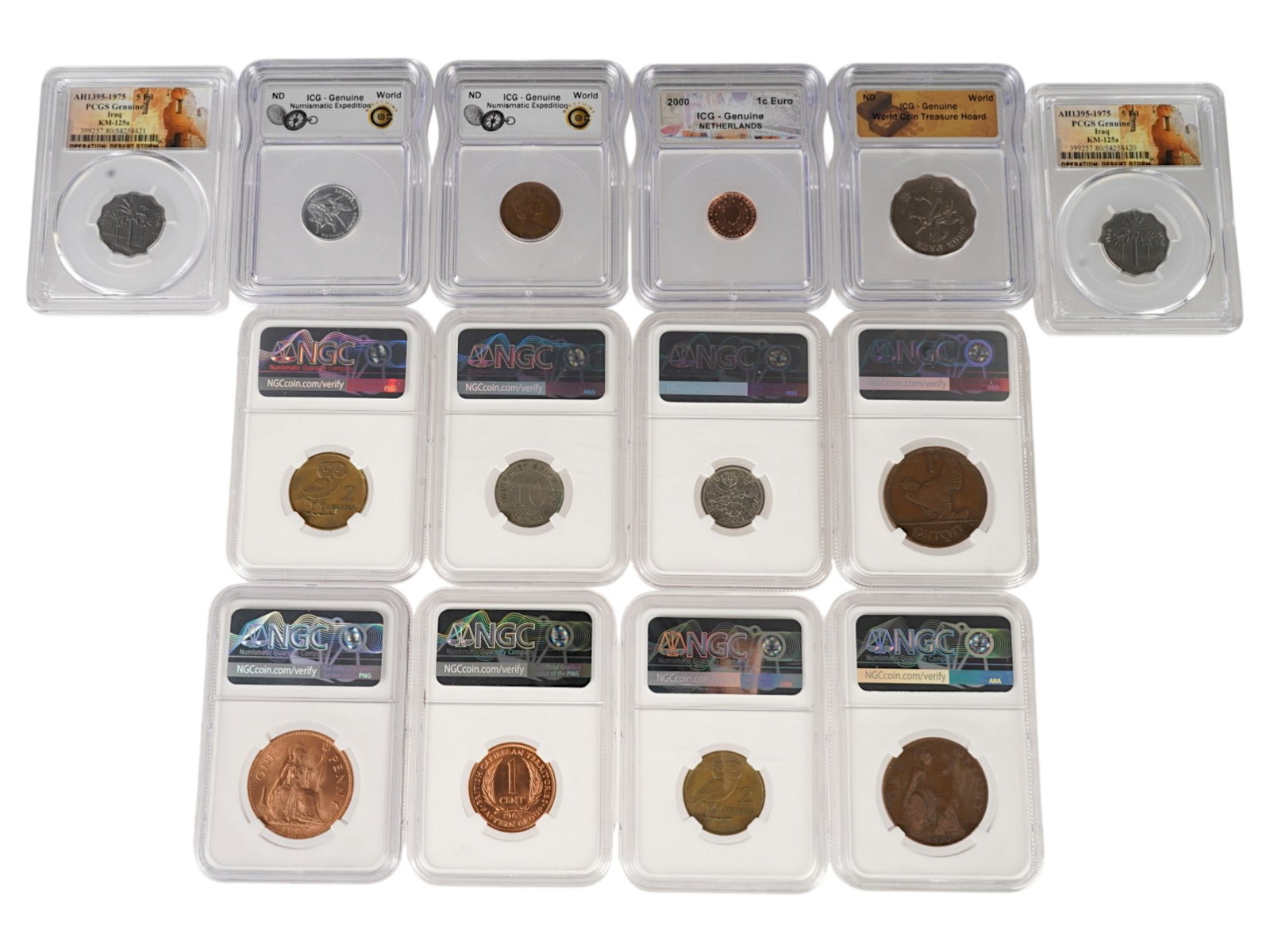COLLECTION OF 14 ANTIQUE AND VINTAGE GRADED COINS: A collection of 14 antique and vintage coins from around the world, from multiple historical periods including the Roman Empire, World War I, and examples of pre-decimal British coinage. The group inc