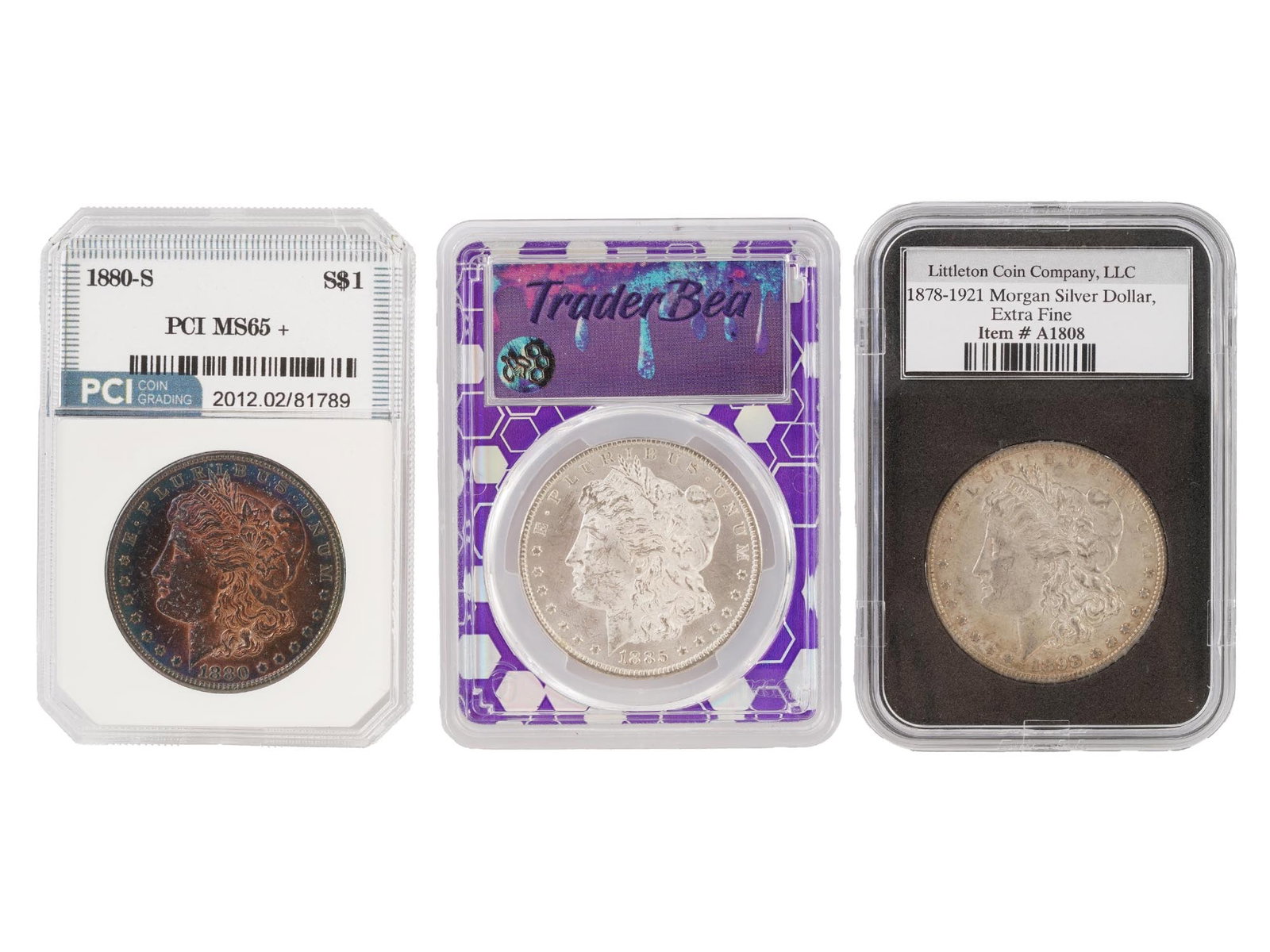 THREE CLASSIC SILVER GRADED MORGAN DOLLAR COINS: A group of three classic Morgan Dollar coins, minted between 1878 and 1921 and composed of silver, each preserved in a different third-party grading or presentation holder. The first coin is an 1880-S