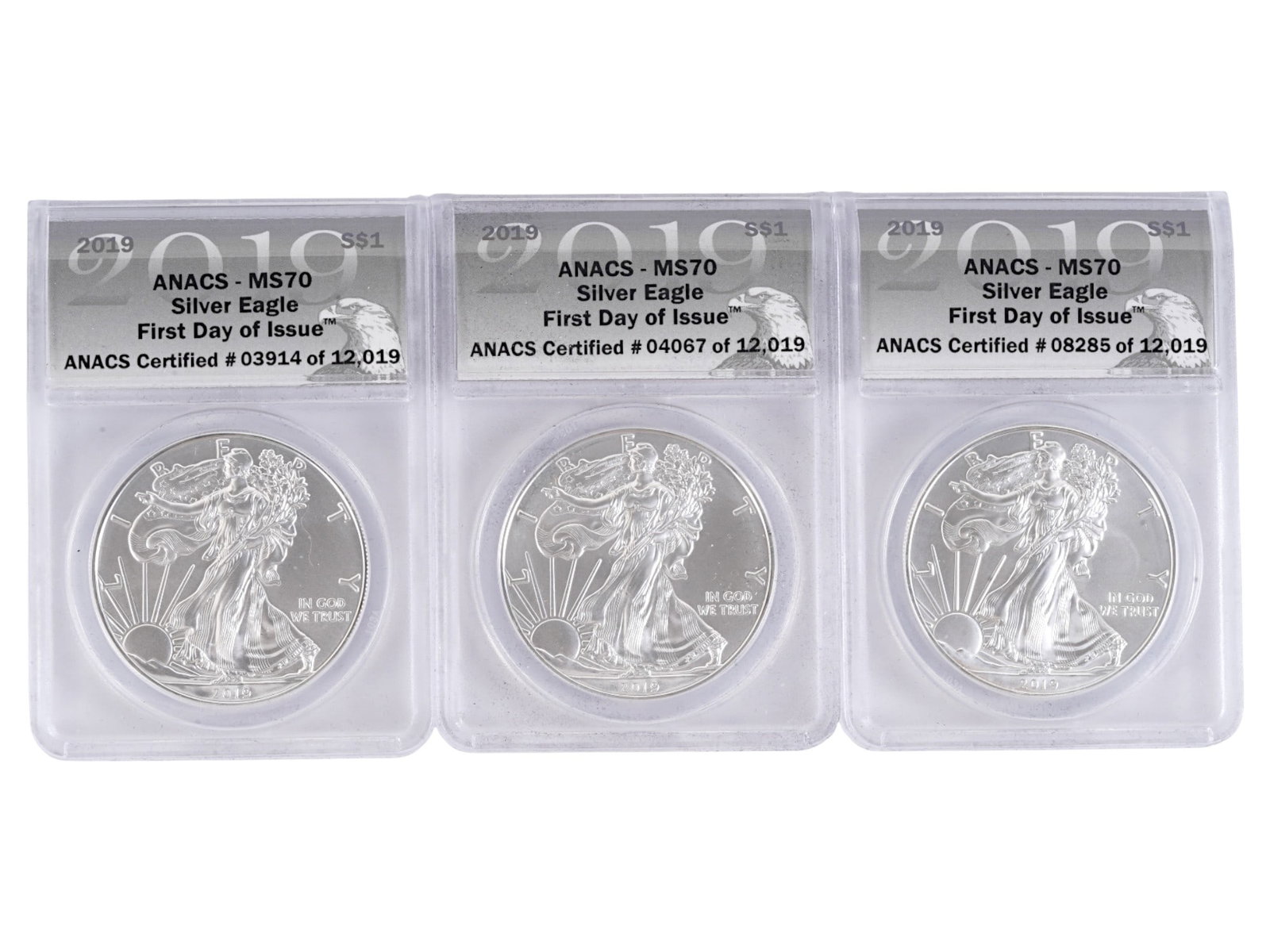 2019 AMERICAN SILVER EAGLE COINS MS70 GRADED FIRST DAY: A set of three 2019 American Silver Eagle coins, each certified MS70 First Day of Issue by ANACS and encapsulated in their original protective holders. Struck in 1 oz of .999 fine silver with a legal