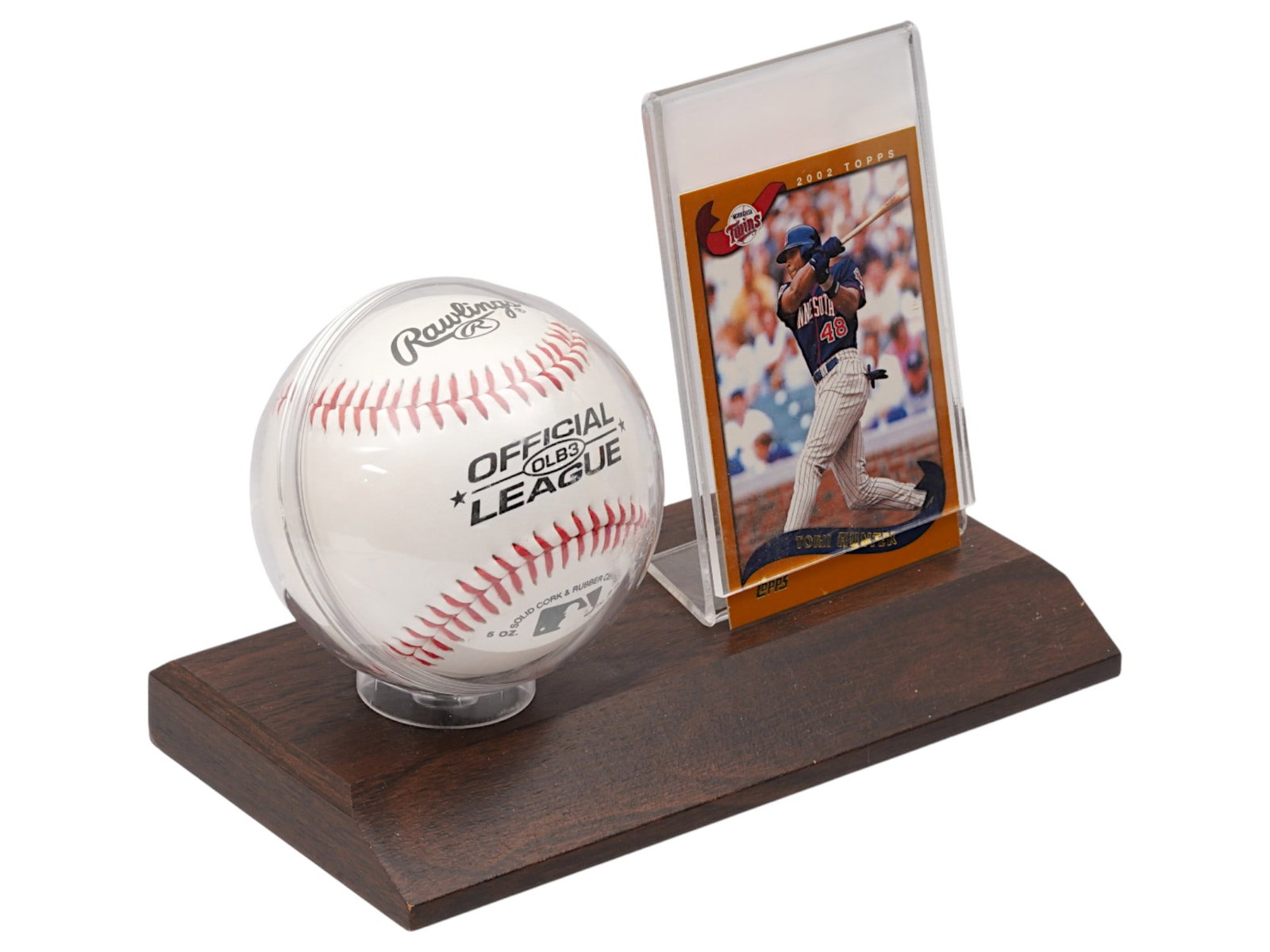 TORII HUNTER AUTOGRAPHED BASEBALL AND TRADING CARD: An autographed by Torii Hunter baseball and 2002 Topps trading card mounted on a wooden stand. Torii Hunter, a prominent center fielder who played for the Minnesota Twins. Hunter was a key player for