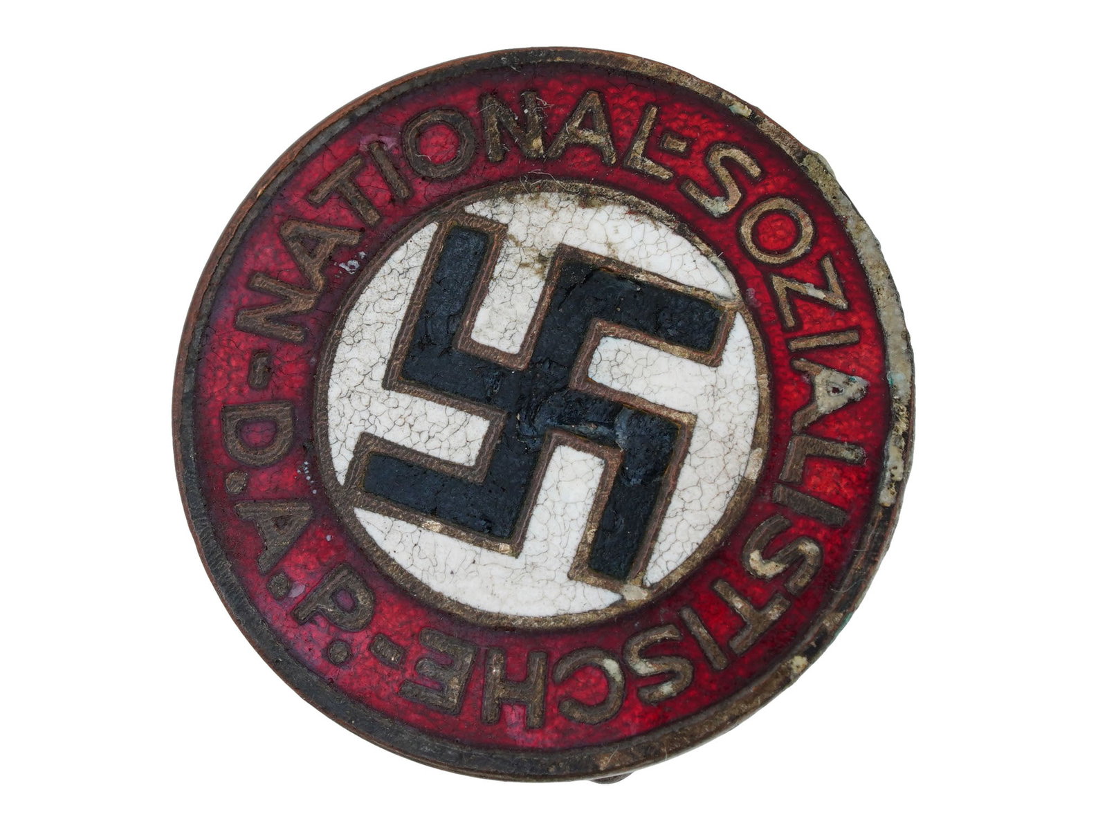 WWII TYPE GERMAN THIRD REICH NSDAP PARTY BADGE: A WWII model Nazi German Third Reich political NSDAP party badge. The front reads, National Sozialistische D. A. P. The badge is enameled with a swastika insignia in the center. Has a thin horizontal 