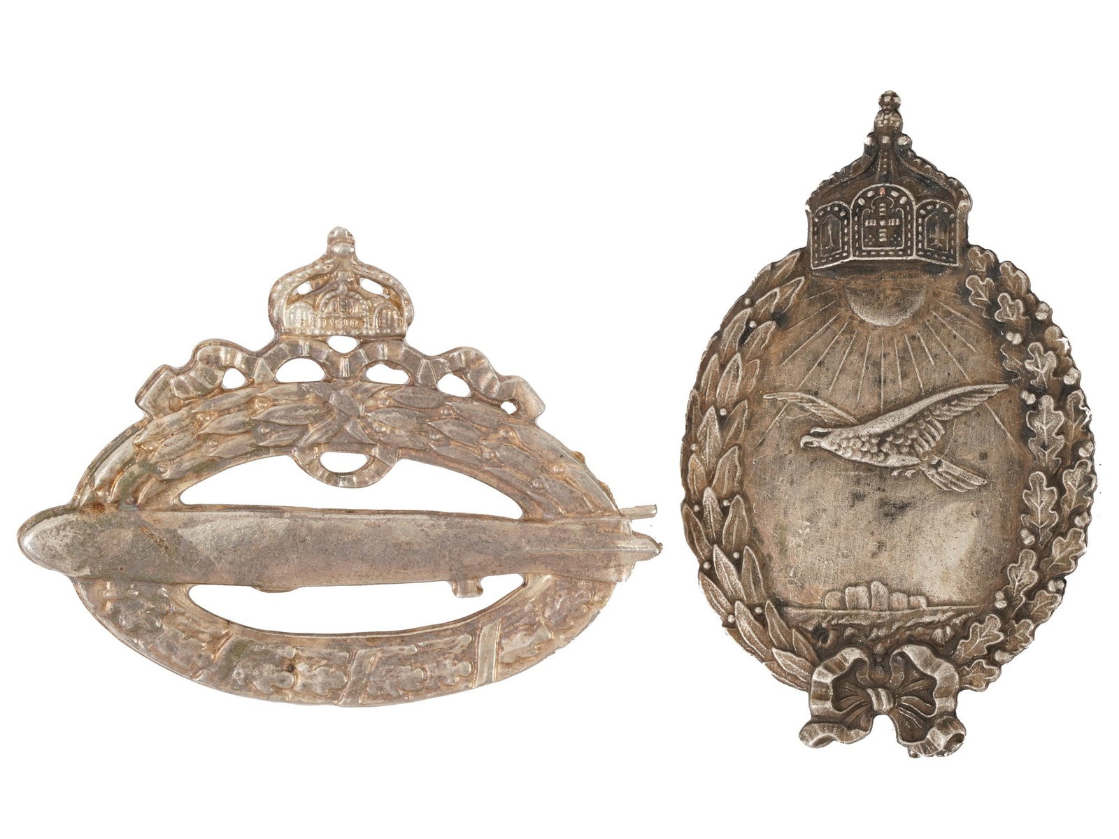PAIR OF WWI MODEL IMPERIAL GERMAN MILITARY BADGES: A pair of WWI model Imperial German military decorations. Navy Zeppelin Pilot. Navy Pilot. One is marked RZM on the backside. First World War Historical Collectibles And Memorabilia, Military Uniform 