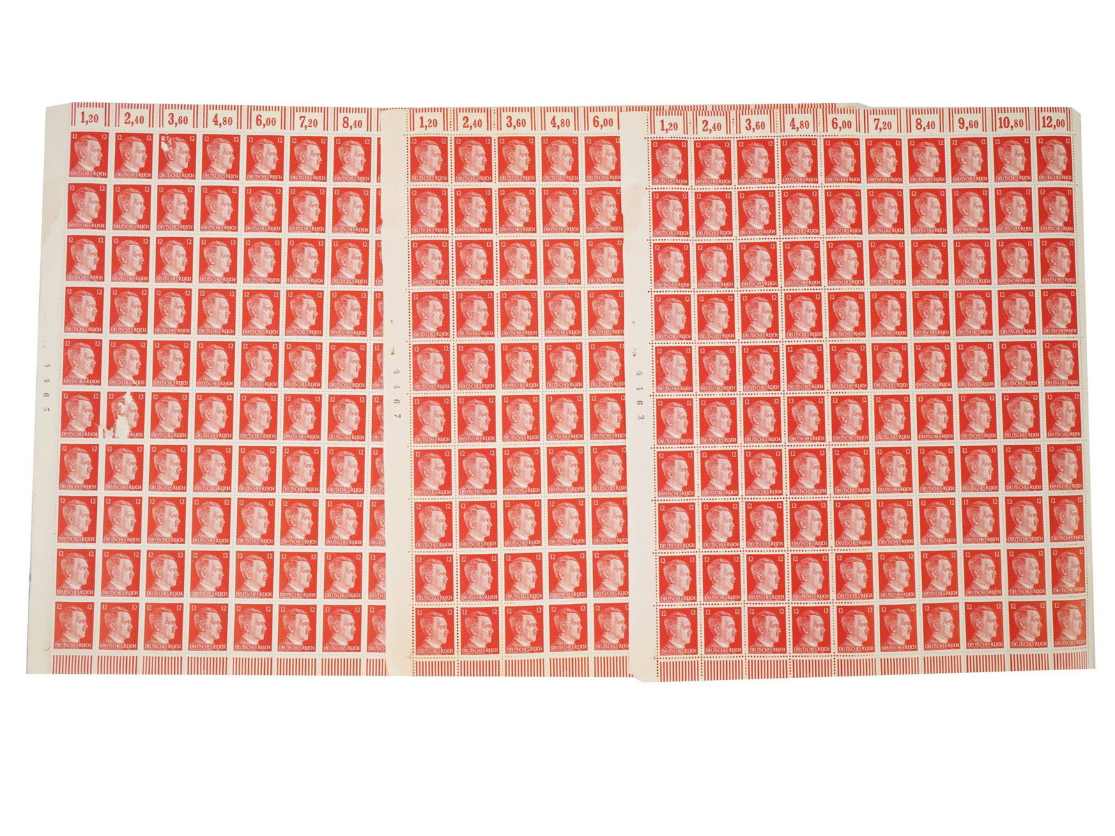 GROUP OF WWII NAZI GERMAN SHEETS OF HITLER STAMPS: A group of three WWII era Nazi German sheets of Hitler stamps with 12 pfennigs denomination. Each sheet has 100 stamps. A total of 300 postal stamps. These stamps are part of the Adolf Hitler definiti