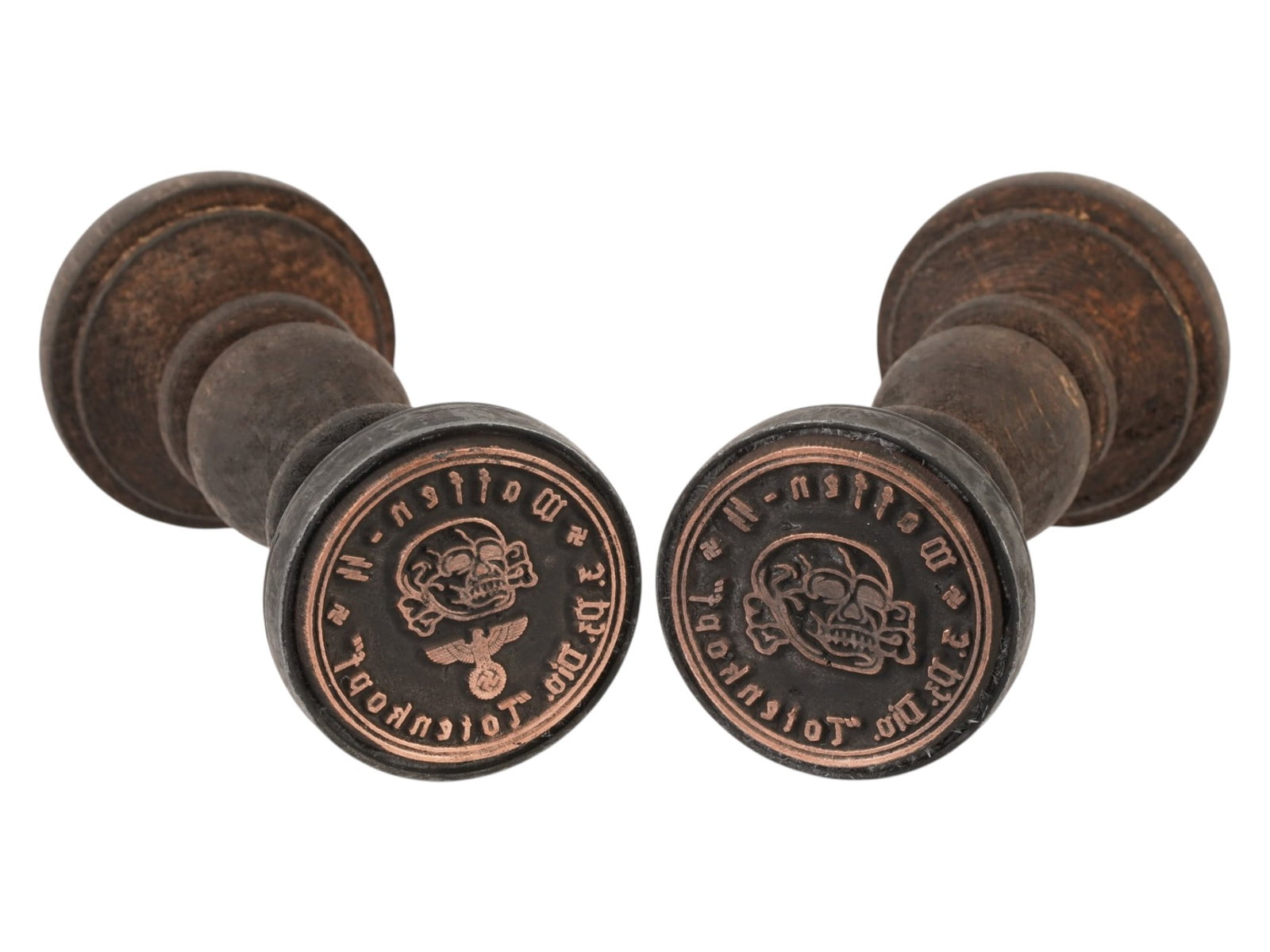 TWO WWII TYPE GERMAN WAFFEN SS TOTENKOPF HAND STAMPS: A lot of two WWII type German Waffen SS hand stamps. Both belong to the division Totenkopf. Featuring traditionally turned baluster handles and circular matrices. The handles are designed with tiered 