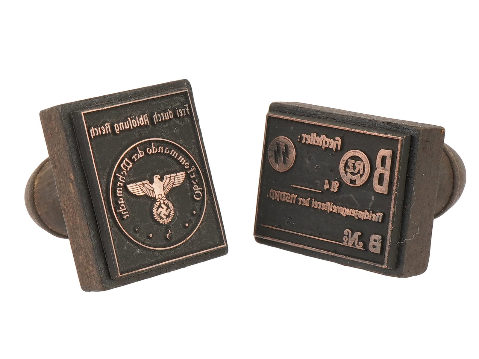 PAIR OF WWII TYPE GERMAN WEHRMACHT HAND STAMPS: A pair of World War II model wooden hand stamps of Nazi German administrations. Reichszeugmeisterei der NSDAP. Oberkommando der Wehrmacht, Frei durch Ablosung Reich. Second World War Historical Collec
