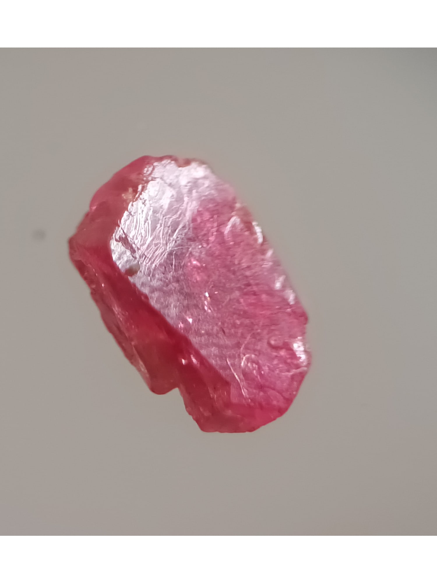 VIBRANT DARK RED SPINEL - UNTREATED GEMSTONE - 4.1 CT.: Vibrant dark red spinel with crystalline faces (spi3/34). Weight: 0.82 grams / 4.1 ct. Origin: Mogok Township, Mandalay Reg. Myanmar. THIS LOT QUALIFIES FOR A 30-DAY UNCONDITIONAL RETURN FROM T
