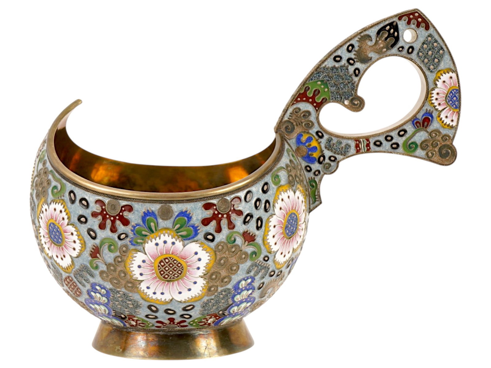 EXTRA LARGE RUSSIAN SILVER CLOISONNE ENAMEL KOVSH: An extra large Russian 88 Silver and enamel kovsh of a characteristic form featuring an oval shaped bowl and a single curved handle. The exterior of the kovsh is enameled with polychrome geometrical,
