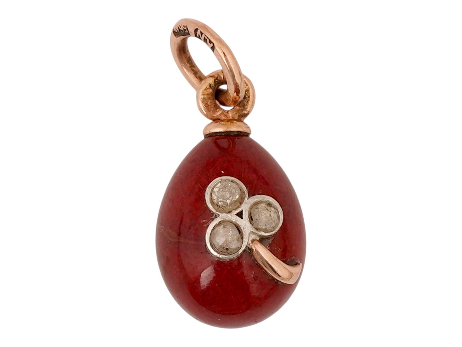 RUSSIAN GOLD PURPURINE DIAMOND EASTER EGG PENDANT: A Russian carved purpurine Easter Egg pendant with 14K gold fittings. The piece is garnished with a diamond flower motif. Hallmark of 56 gold standard and makers mark are on the fitting ring. Total