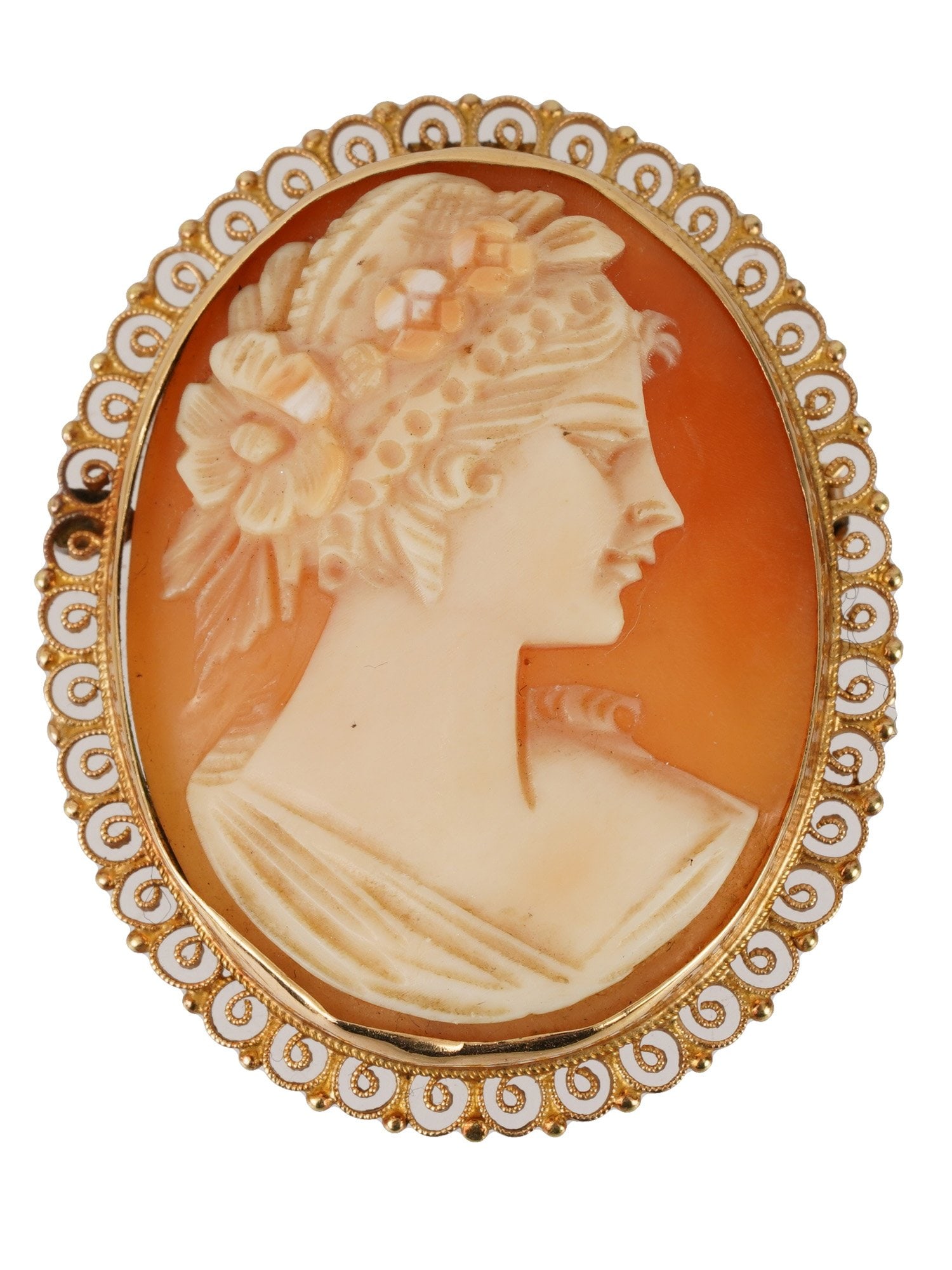 VINTAGE 14K GOLD FEMALE CAMEO BROOCH PENDANT: A vintage 14K gold cameo brooch pendant. The brooch is an oval medallion set with an engraved gem representing a profile female portrait with flowers. Hallmark 14K is on the pin. There is a