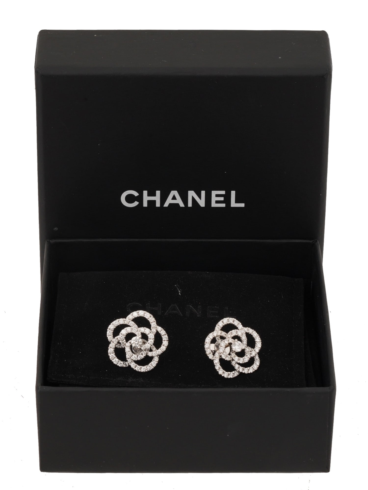 CHANEL 18K WHITE GOLD DIAMONDS CAMELLIE EARRINGS: A pair of Chanel 18K white gold and diamond earrings, designed in the shape of camellias. The earrings feature a multi petal arrangement formed by diamond studded loops. Each earring has a larger,