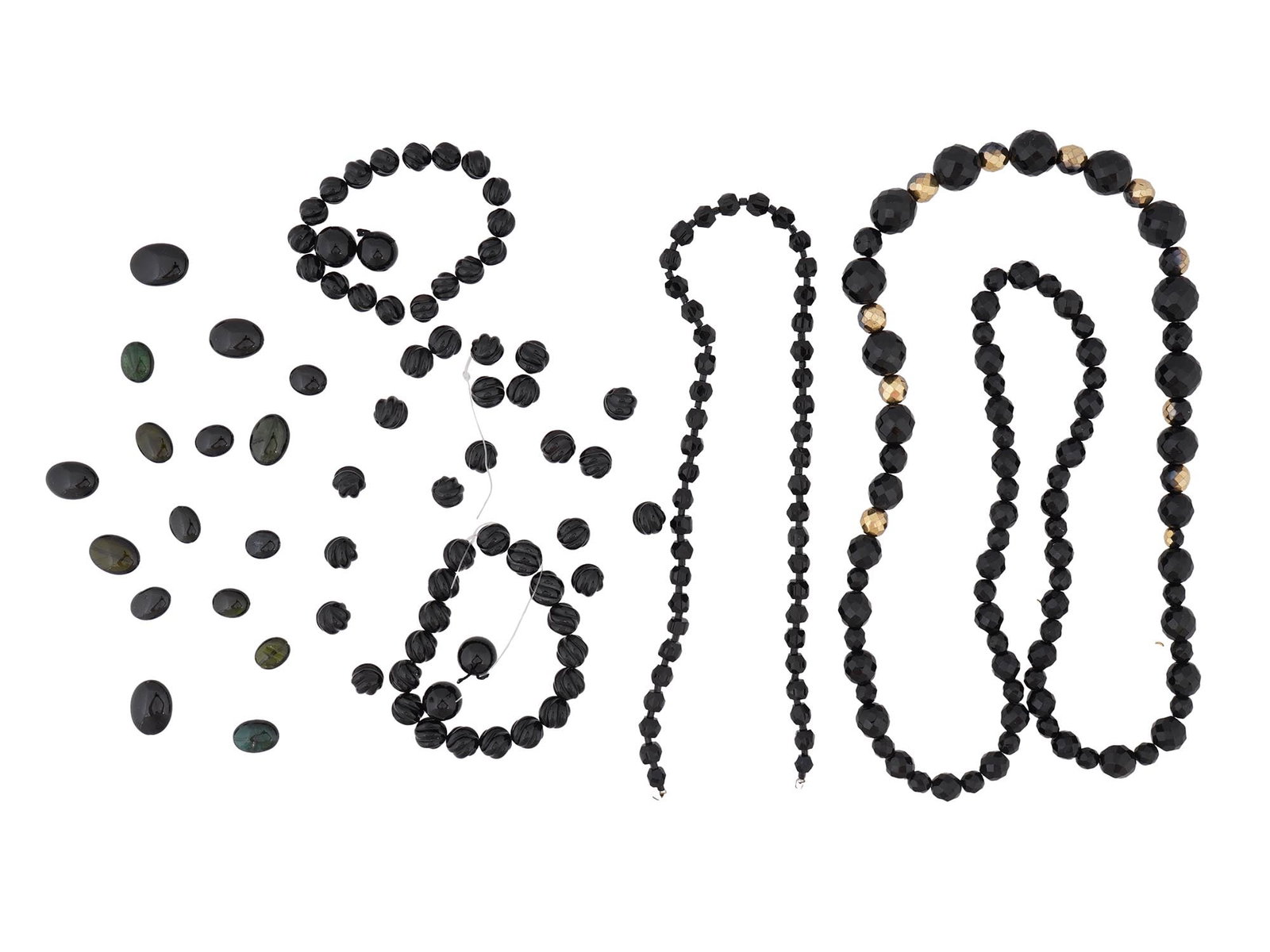 COLLECTION OF ASSORTED CARVED ONYX BEADS STRINGS: A collection of strings with assorted carved black Onyx stone manner beads. The beads are made in various sizes and shapes including .oval, circular, and lobed designs. Vintage Jewelry For Women,