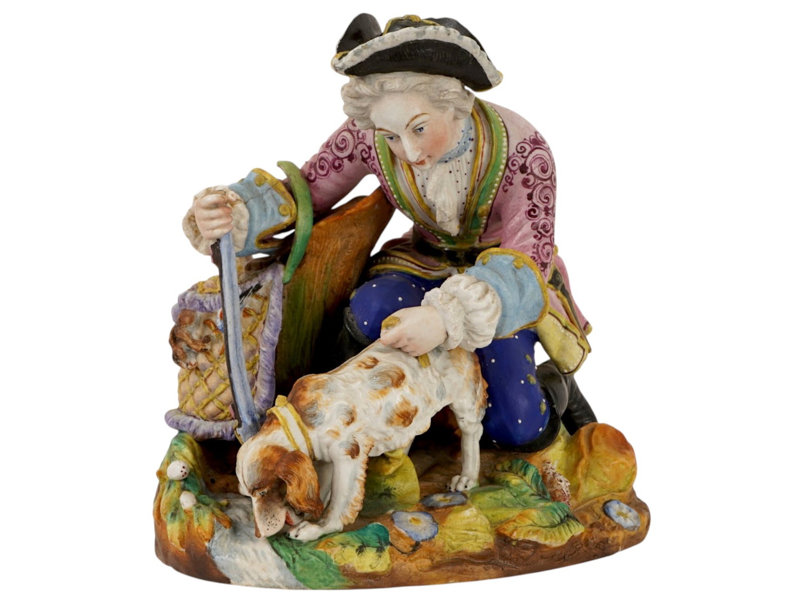 ANTIQUE 19TH C PORCELAIN FIGURINE MAN WITH HOUND: A Jean Gille, Vion and Baury style polychrome porcelain figurine depicting a gentleman in 18th-century attire, featuring a pink patterned frock coat, blue breeches, and a black tricorne hat. The centr