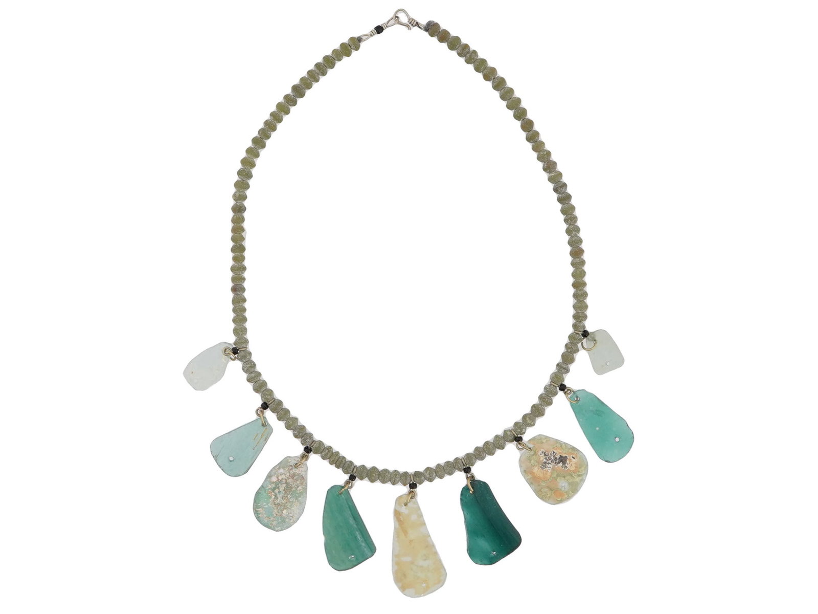 ANCIENT ROMAN GLASS BEAD NECKLACE 100 TO 300 AD: An ancient Roman glass bead necklace, dating from 100 to 300 AD. The necklace is composed of small, round beads. Hanging from the bottom of the necklace are fragments of Roman glass in varying shades 