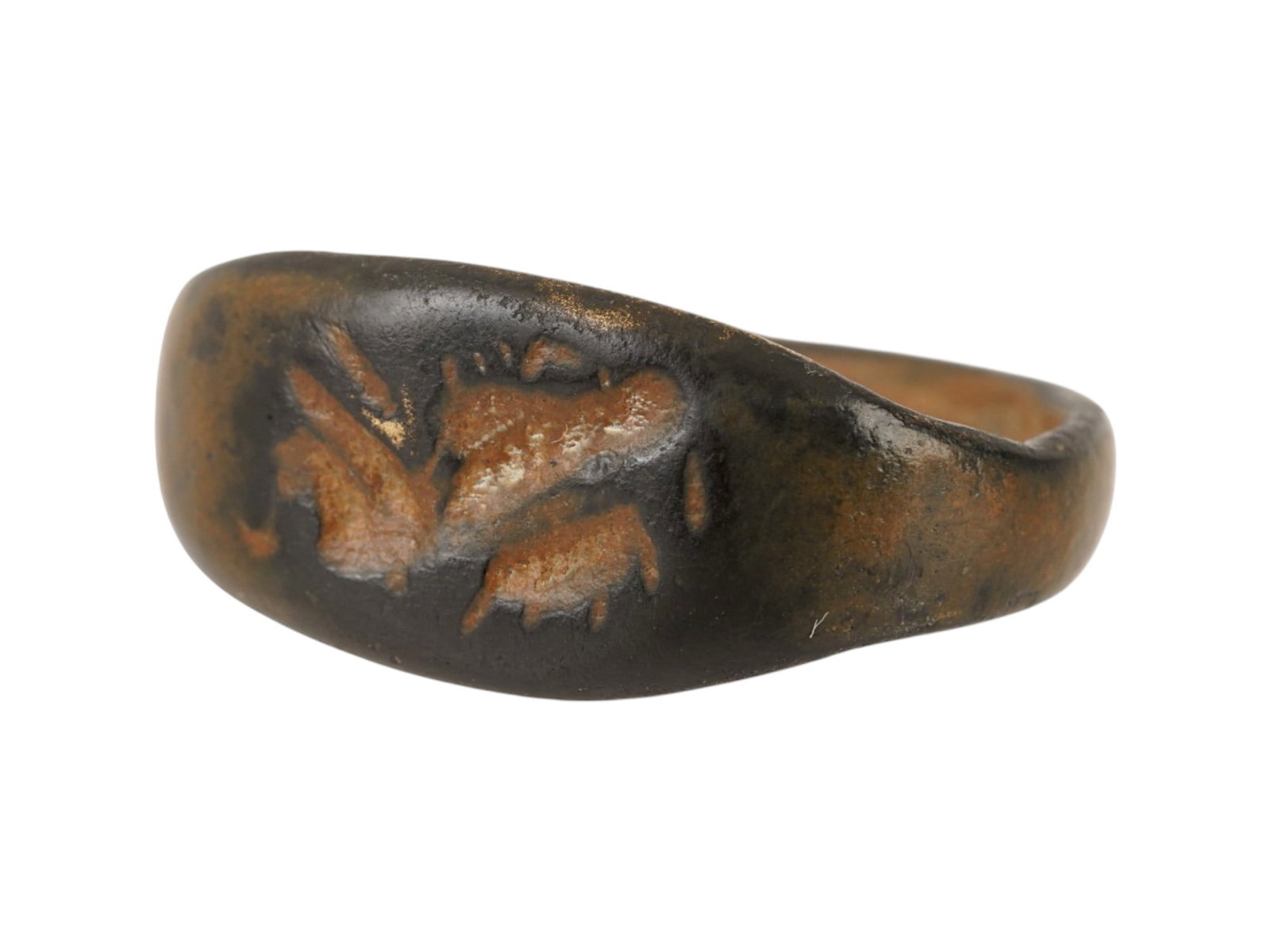 ANCIENT ROMAN ENGRAVED BRONZE SIGNET RING 100 TO 300 AD: An ancient Roman bronze signet ring, dating circa 100 to 300 AD, features a flat, oval bezel engraved with a head representing the goddess Aphrodite. The intaglio-style engraving is rendered with styl