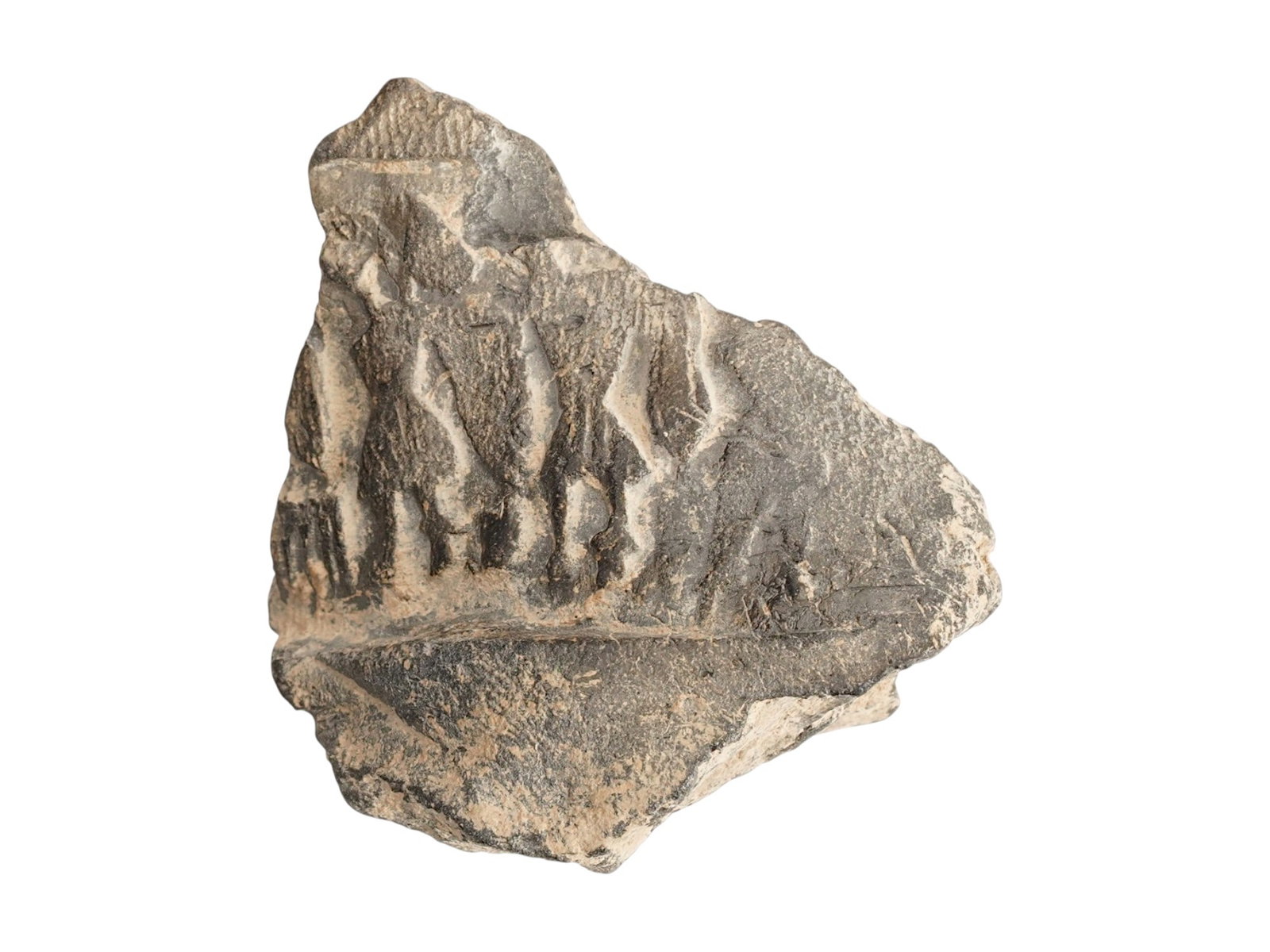 ANCIENT NEAR EASTERN FRAGMENT 2ND TO 1ST MILLENIUM BC: An Ancient Near Eastern clay fragment featuring a relief impression of standing figures, likely produced from a cylinder seal. The fragment is irregularly shaped with broken edges, revealing the coars