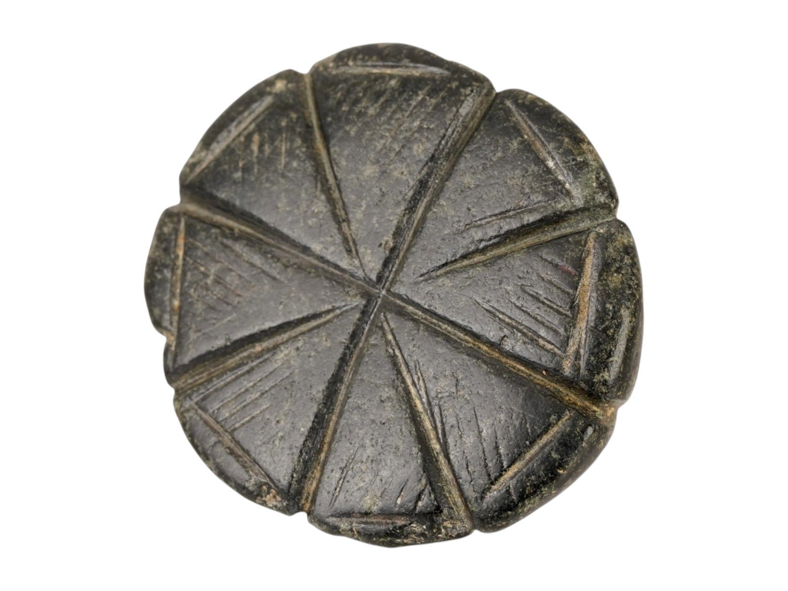 ANCIENT BYZANTINE STEATITE STAMP SEAL 400 TO 600 AD: An ancient Byzantine hand carved steatite stamp seal, circa 400 to 600 AD, features a characteristic domed handle with a transverse perforation for suspension. The circular sealing face is deeply inci