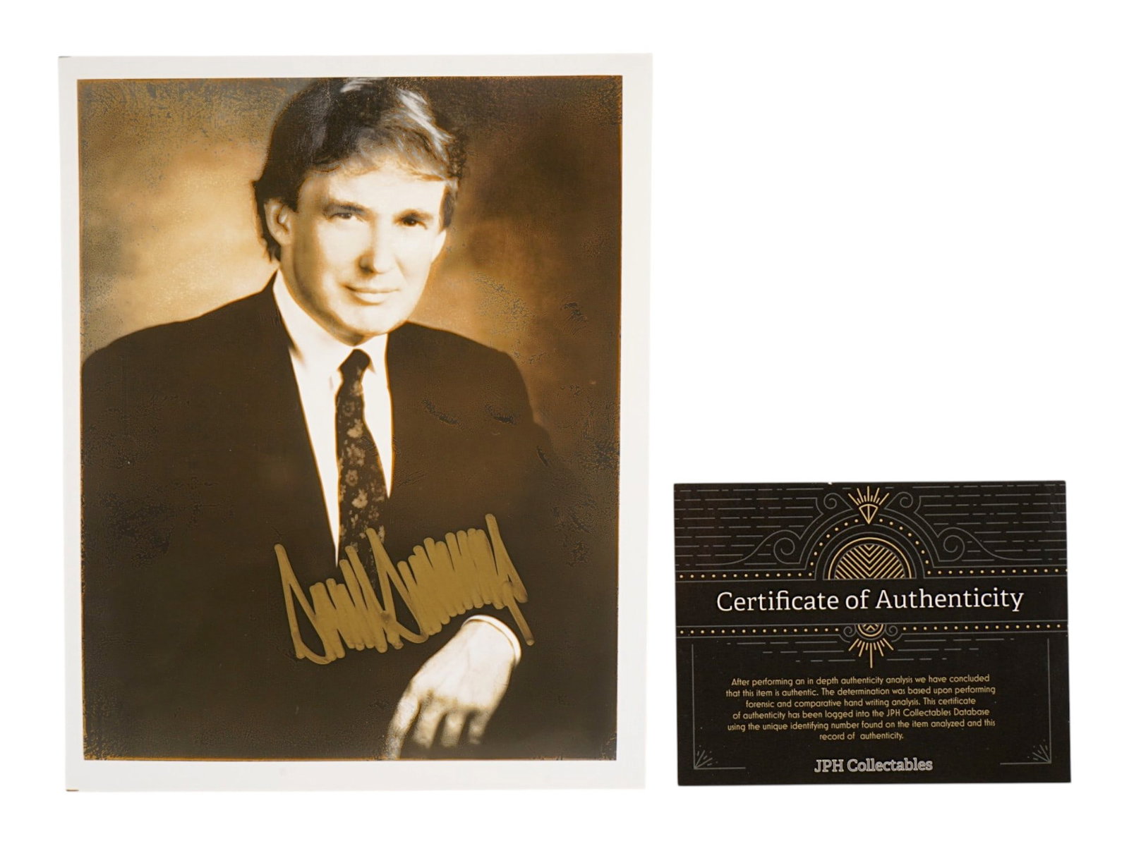 PHOTO OF US PRESIDENT DONALD TRUMP WITH AUTOGRAPH W COA: A studio portrait photograph of the 45th American president Donald Trump. Dated 1999. Signed by Trump in golden felt tip marker lower. Accompanying the piece is a Certificate of Authenticity from JPH 