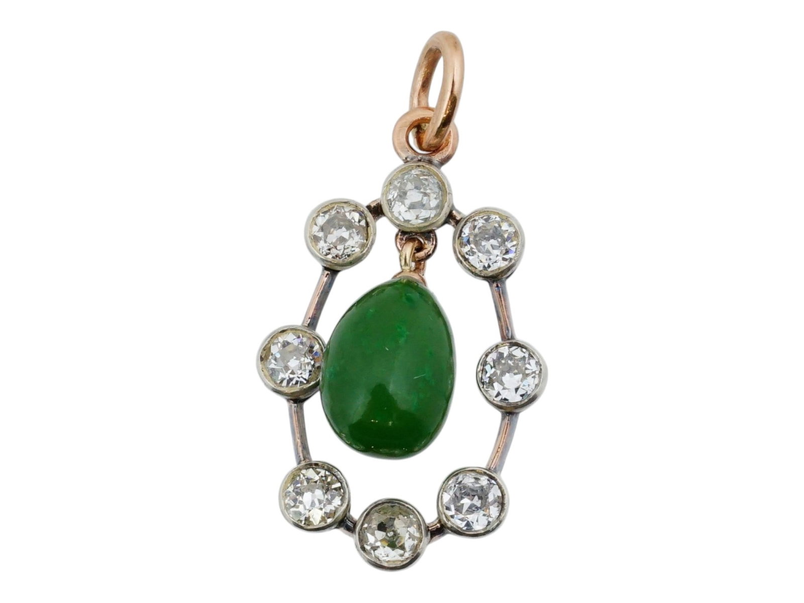 RUSSIAN GOLD NEPHRITE JADE PENDANT WITH DIAMONDS: A Russian gold egg-shaped nephrite jade pendant mounted in an oval gold frame encrusted with eight diamonds. Marked with a gold standard and the makers mark on the pendant ring. Hand Carved Gemstone C