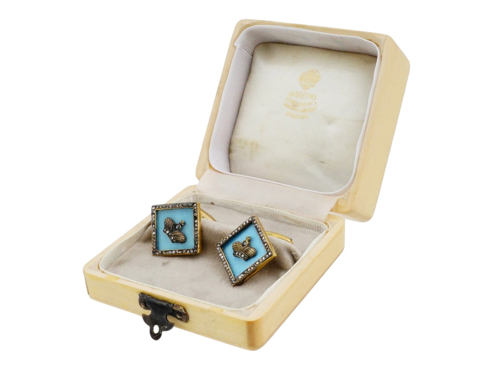PAIR OF RUSSIAN SILVER AND ENAMEL DIAMOND CUFFLINKS: A pair of Russian gilt silver and guilloche enamel cufflinks of square form, featuring translucent light blue enamel. Each cufflink is centered with an applied Imperial crown motif set with rose-cut d