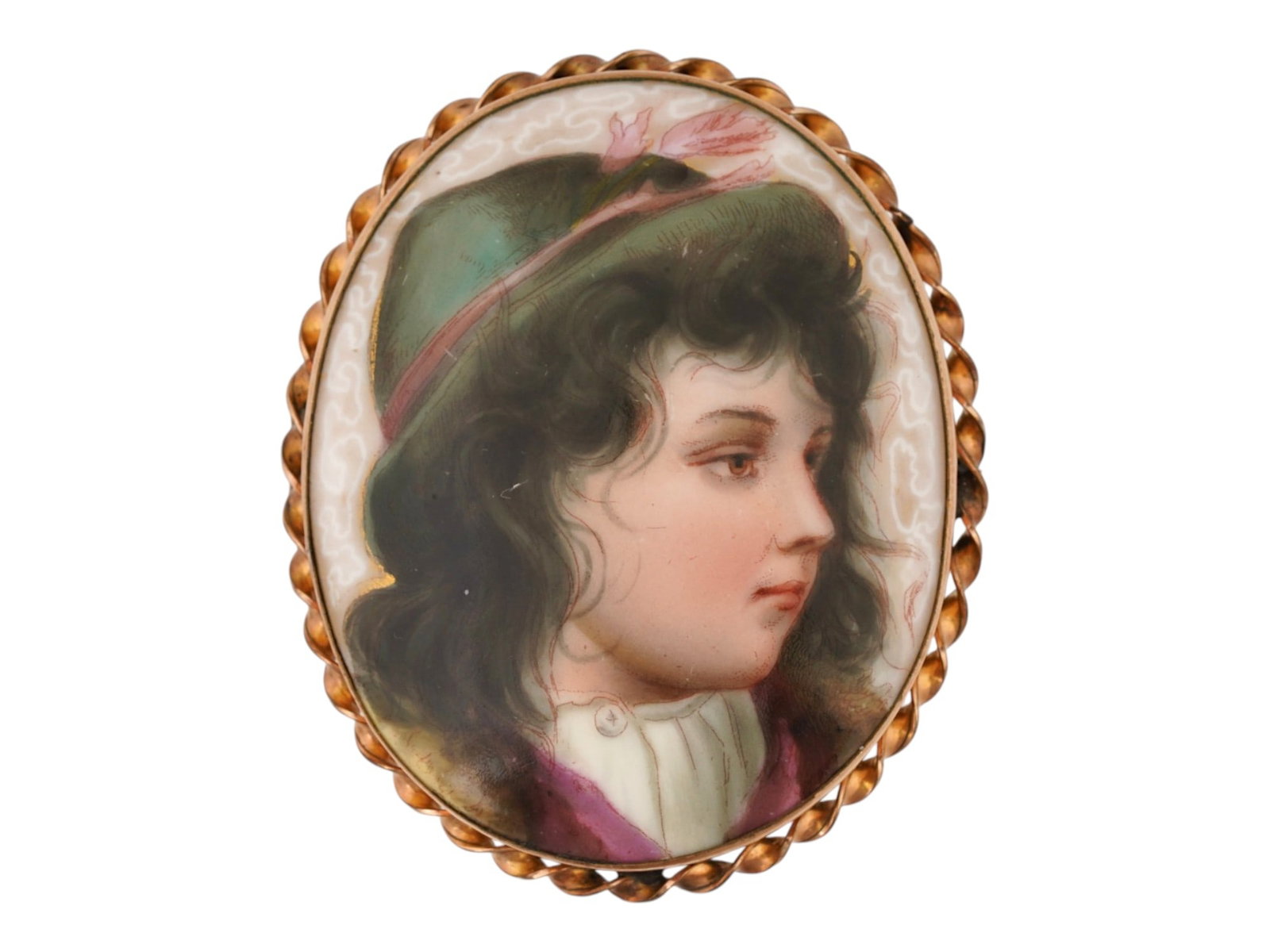 ANTIQUE EUROPEAN PAINTED PORCELAIN CAMEO BROOCH: An antique European, presumably German hand-painted porcelain cameo brooch. The brooch depicts a portrait in an oval, a little girl in the right profile with dark, wavy hair and green hat. It is house