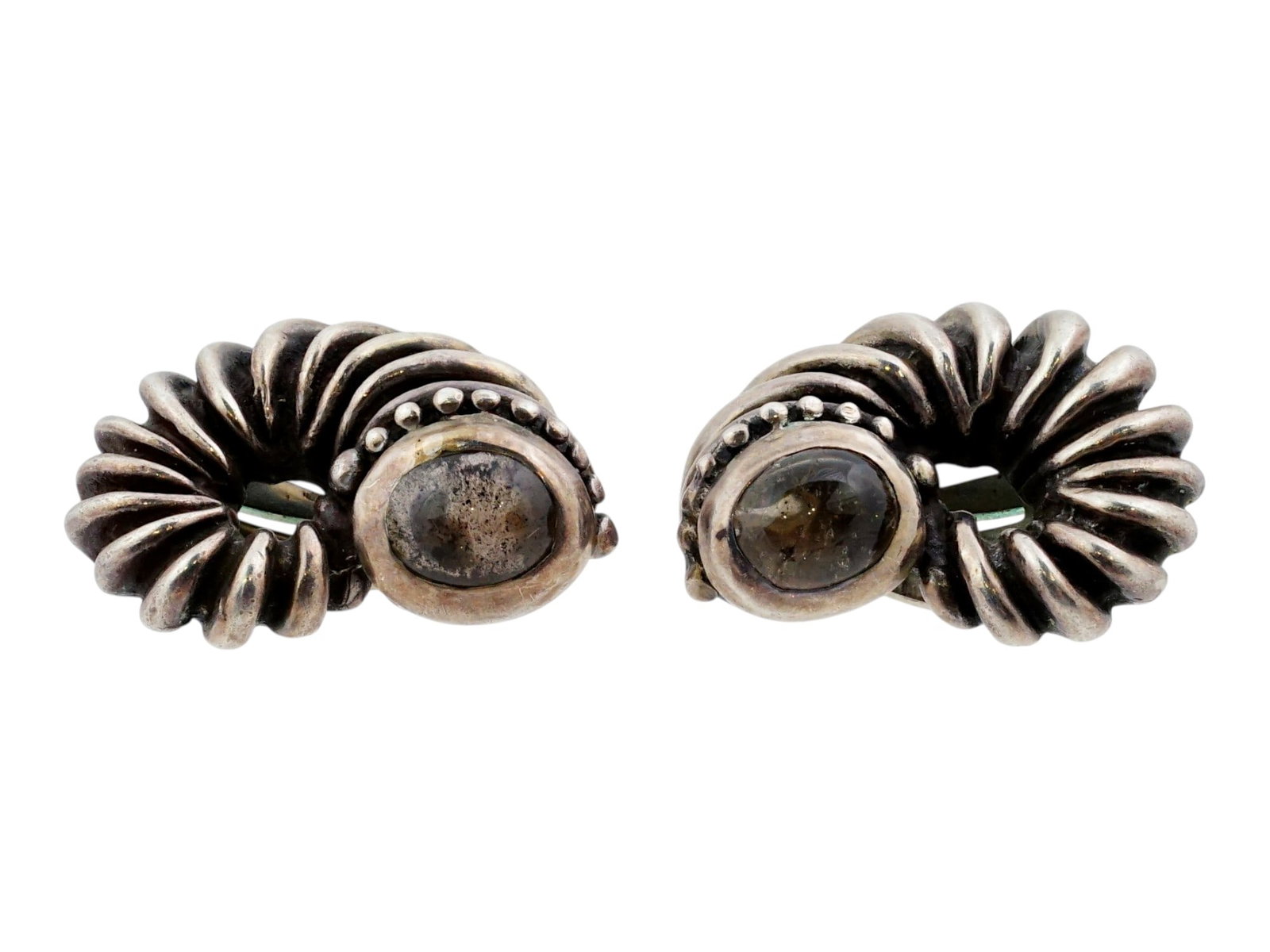 VINTAGE SILVER EARRINGS DAVID YURMAN COOKIE COLLECTION: A pair of vintage stud earrings from the David Yurman Cookie Collection, showcasing the designers iconic cable motif in sterling silver. The earrings feature ribbed spiral settings surrounding dark ca