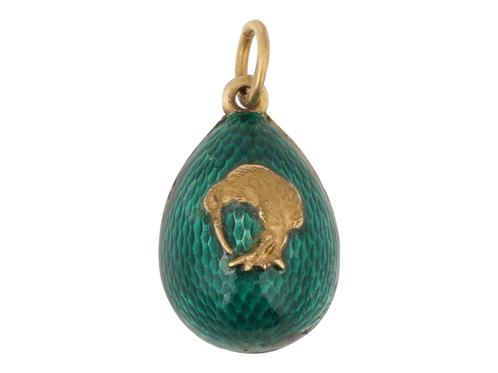 RUSSIAN GILT SILVER AND ENAMEL EASTER EGG PENDANT: A Russian gilt Silver and enamel Easter egg pendant. The exterior of the egg is covered with Guilloche enamel in a green shade and adorned with a relief design representing a kiwi bird. Marked with an