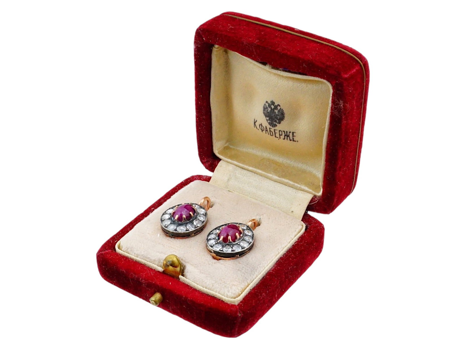 RUSSIAN 14K GOLD EARRINGS WITH DIAMOND AND RUBY: A pair of Russian lever-back earrings with diamond and ruby made of 14K gold. The central oval ruby gemstone is surrounded by twelve diamonds of smaller size. Hallmarked with 56 gold standard and make