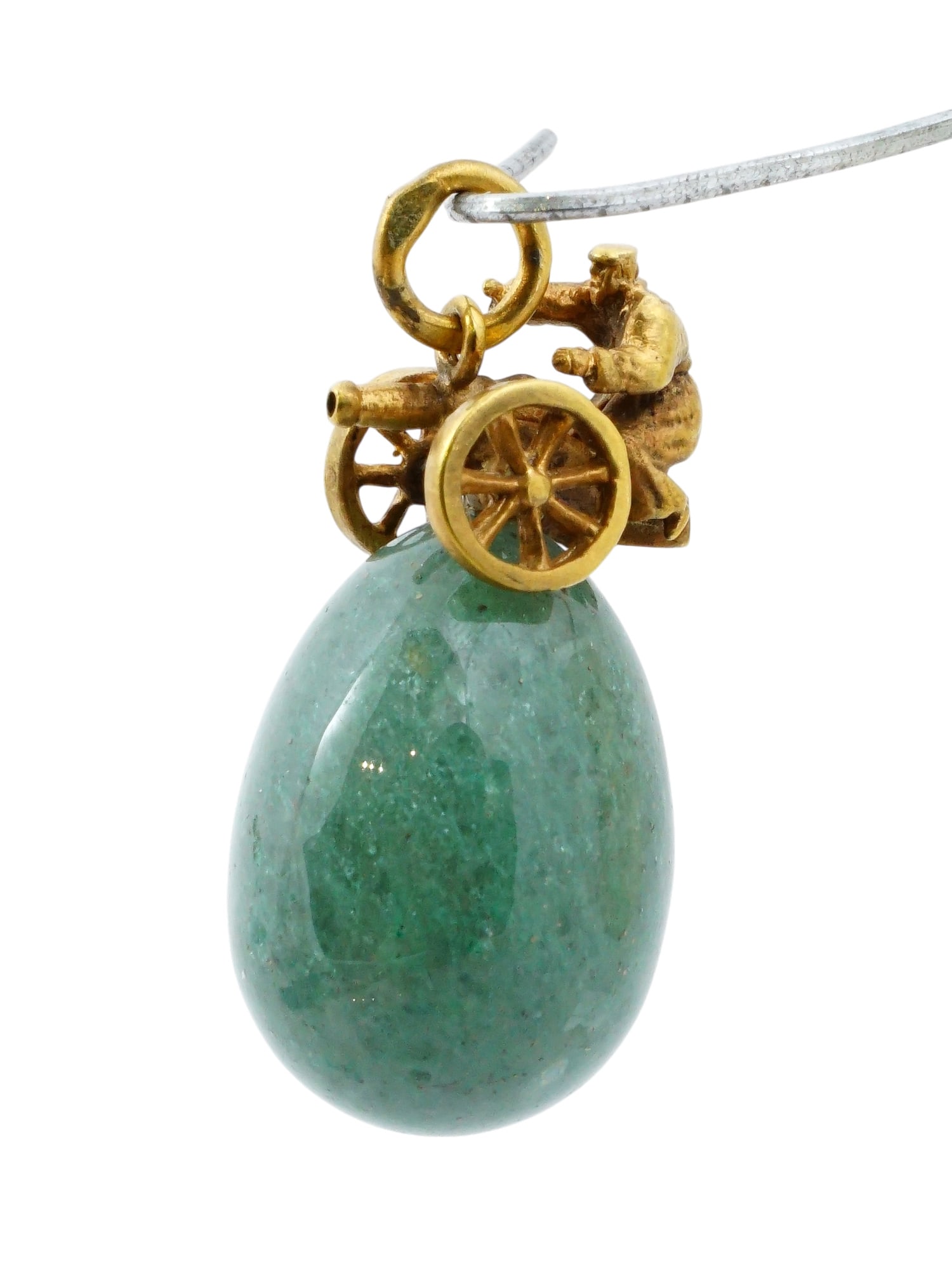 RUSSIAN SILVER AND NEPHRITE JADE EASTER EGG PENDANT: A Russian carved nephrite jade Easter Egg pendant with gilt silver fittings. A figurine of a soldier at a cannon tops the egg. Hallmark of 84 silver standard and makers mark are on the suspension ring