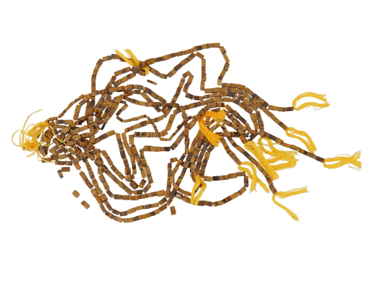 LOT OF 11 TIGERS EYE STONE BEAD STRANDS FOR JEWELRY: A lot of 11 strands of tigers eye stone beads ready for use in jewelry making. The beads are carved into a rectangular tube with a smooth, polished finish. Natural Stone Beads, Jewelry Wares, and Acce