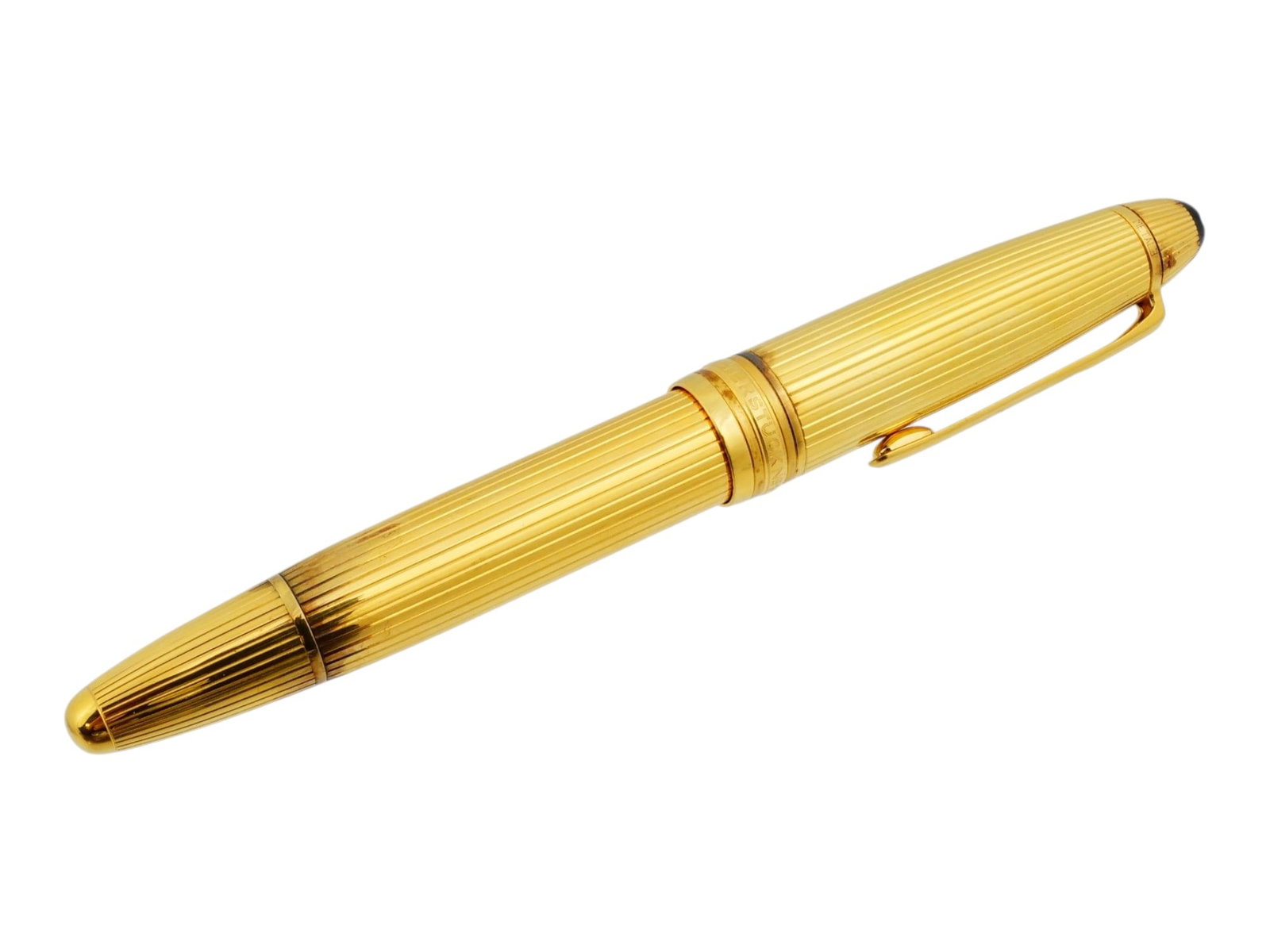 MONTBLANC MEISTERSTUCK GILT SILVER FOUNTAIN PEN: A Montblanc Meisterstuck gilt silver fountain pen. It features a stripe pattern throughout the barrel. The cap is topped with the iconic Montblanc white star emblem, and the center band is engraved wi