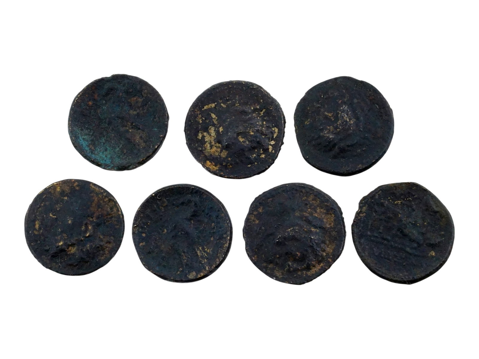 ANTIQUE GRAND TOUR GREEK STYLE BRONZE COINS: A collection of seven antique Grand Tour Greek style bronze coins. Each features inscriptions and impressed images and imperial portraits on opposing sides. Antique Grand Tour Souvenirs And Numismatic